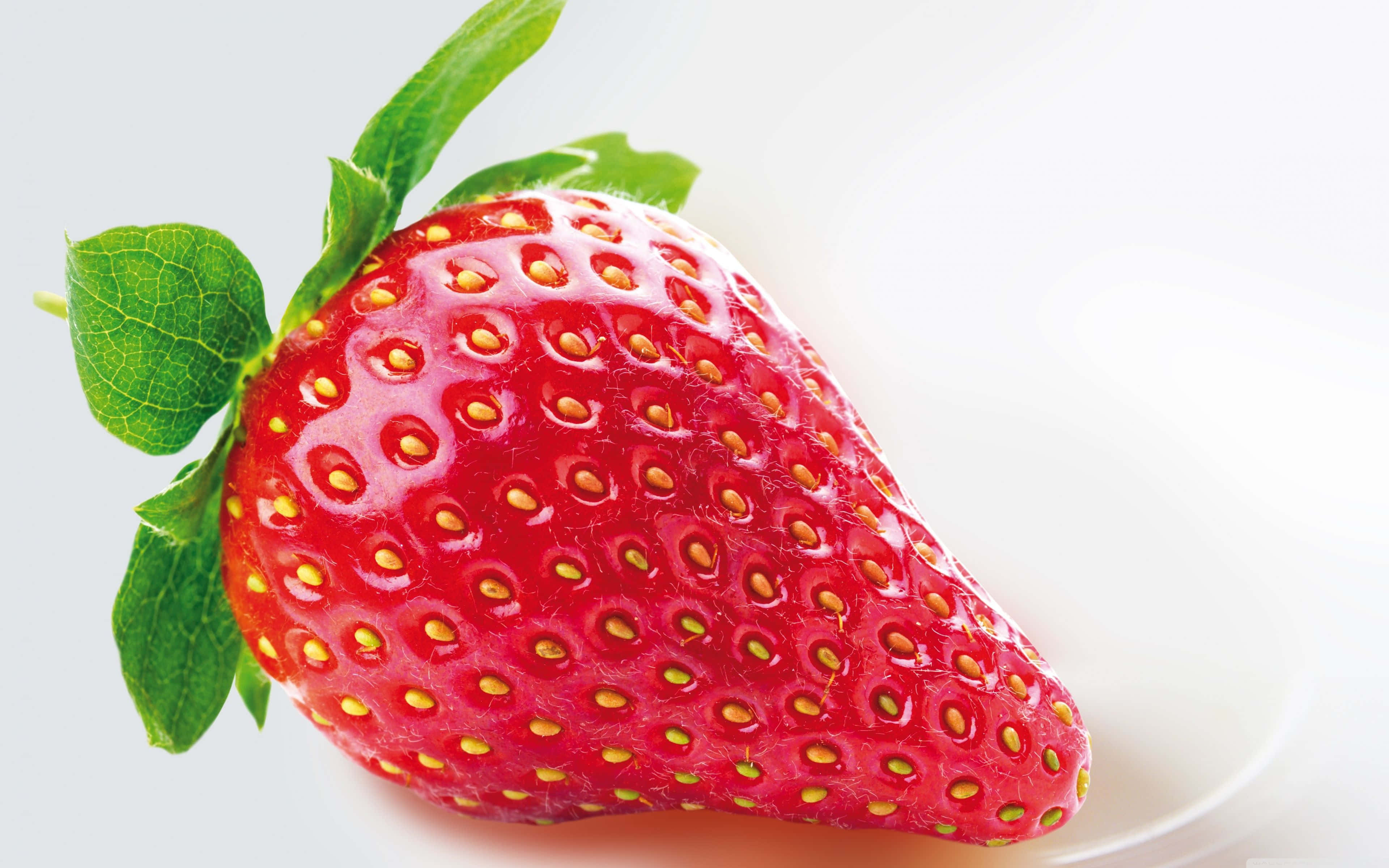 Red Strawberry, vibrant red strawberry, green leaves, 4K Desktop Wallpaper