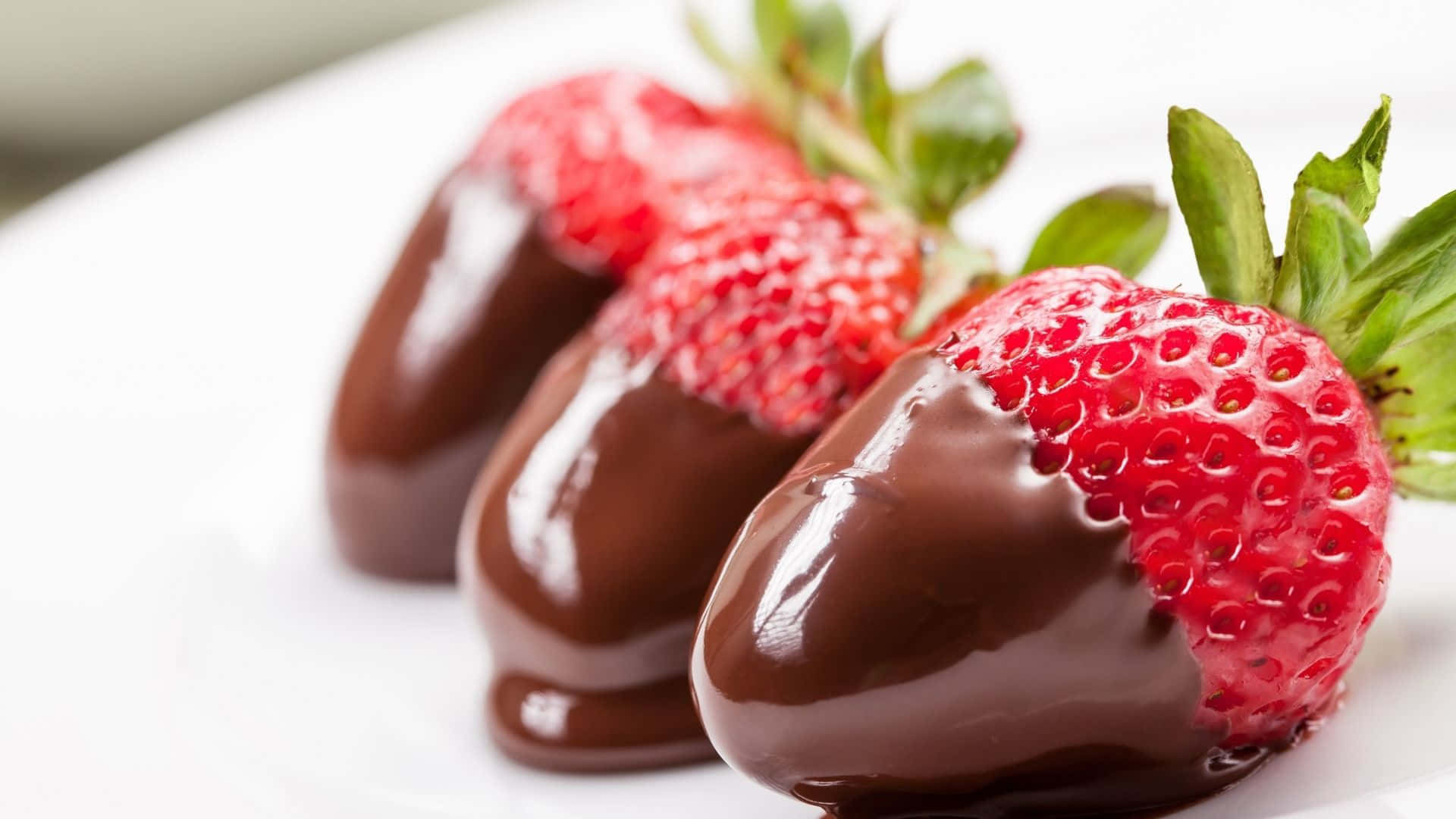 Red Strawberry, glossy chocolate-dipped strawberries, green tops, Full HD Desktop Wallpaper