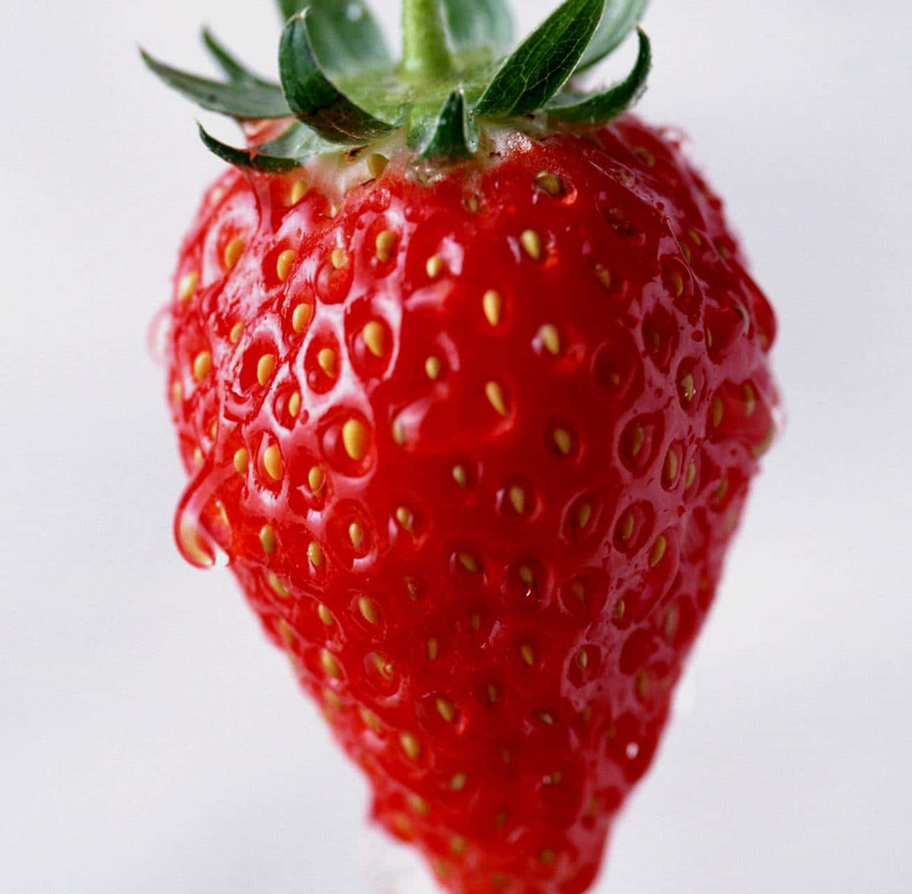 Red Strawberry, vibrant red, green leaves, HD Desktop Wallpaper