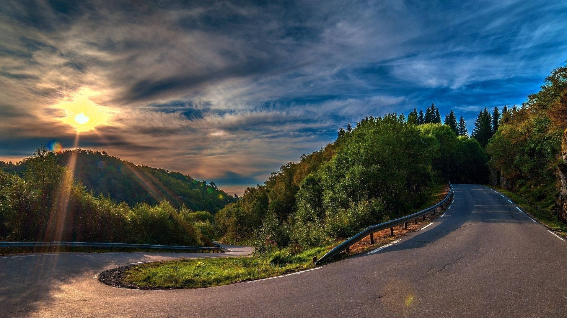 sunset road, winding asphalt road, lush green forests, Full HD Desktop Wallpaper