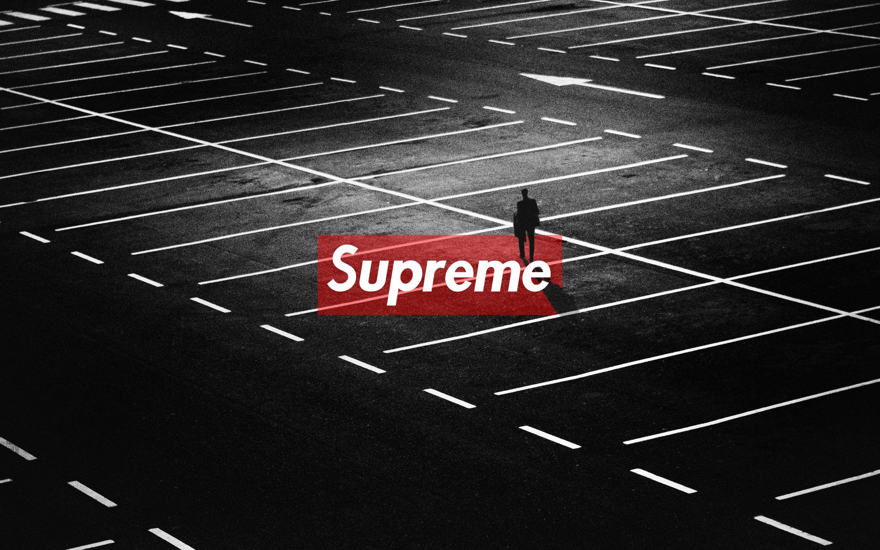 Red Supreme, empty parking lot, artificial light, 2K Desktop Wallpaper