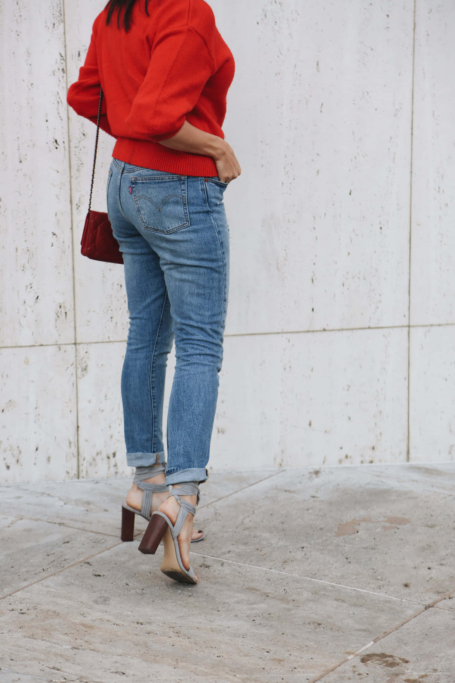 red sweater, blue jeans, white concrete wall, 2K Phone Wallpaper
