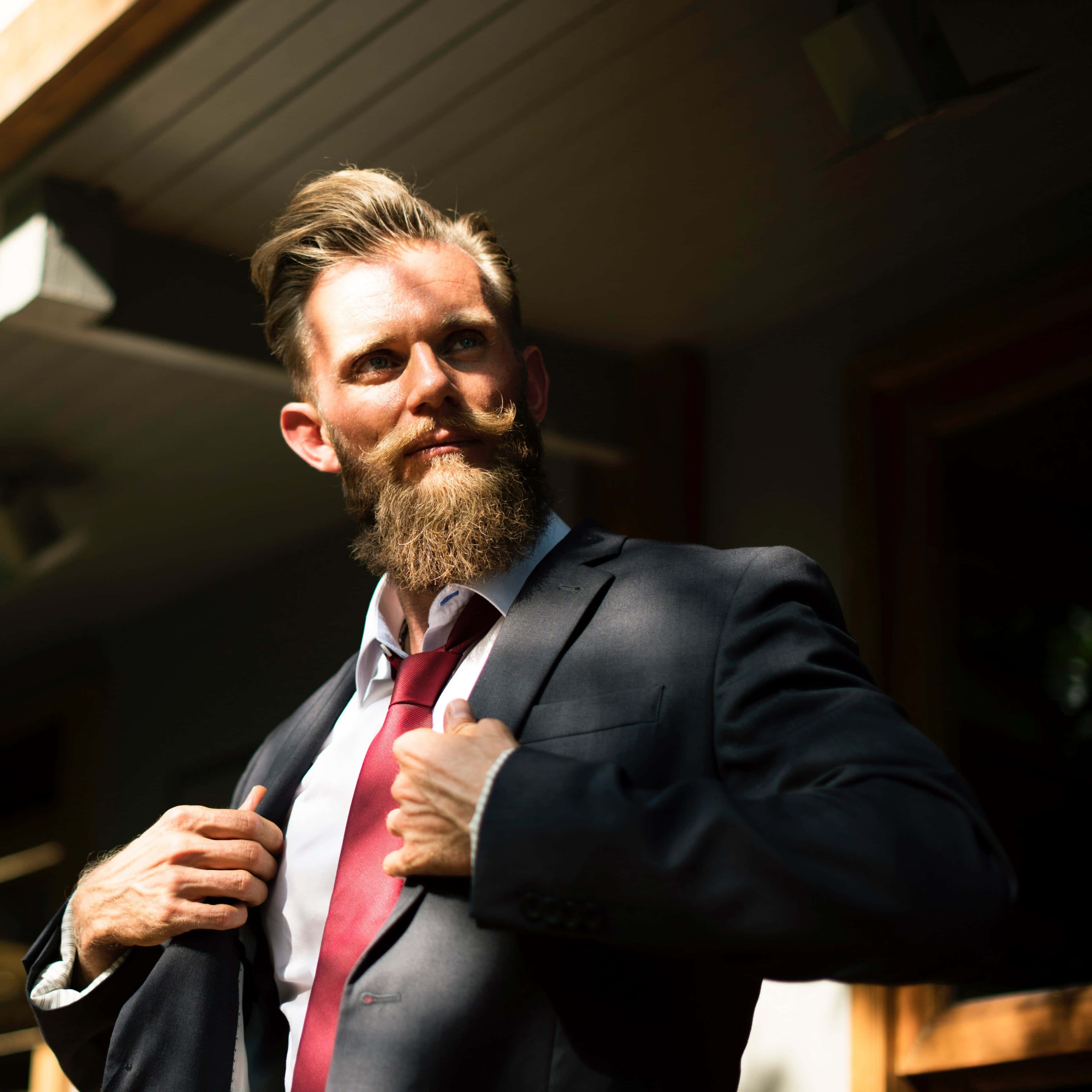Red Tie, dark suit, warm sunlight, 4K Desktop Wallpaper