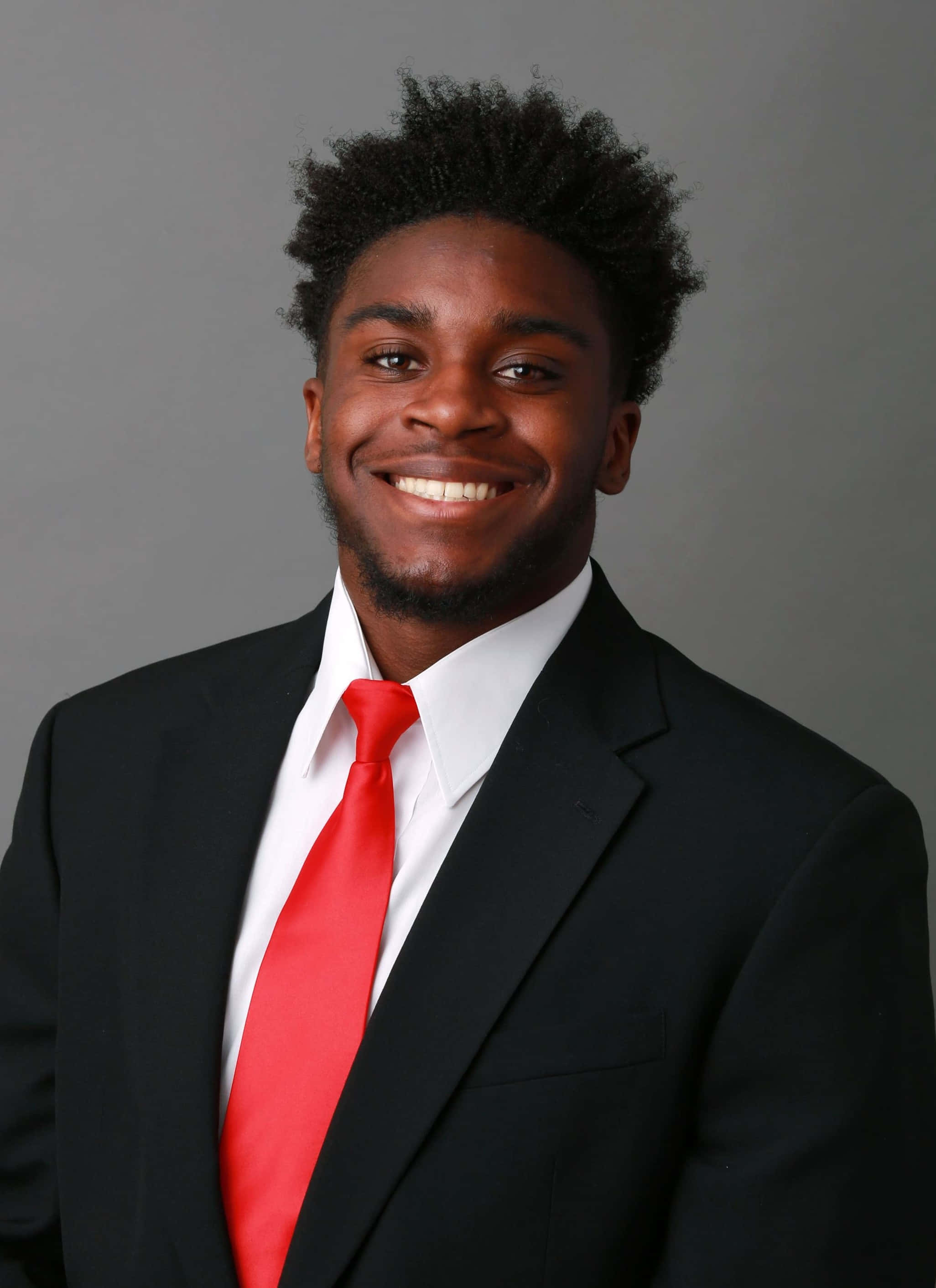young man, curly black hair, black suit, 2K Phone Wallpaper