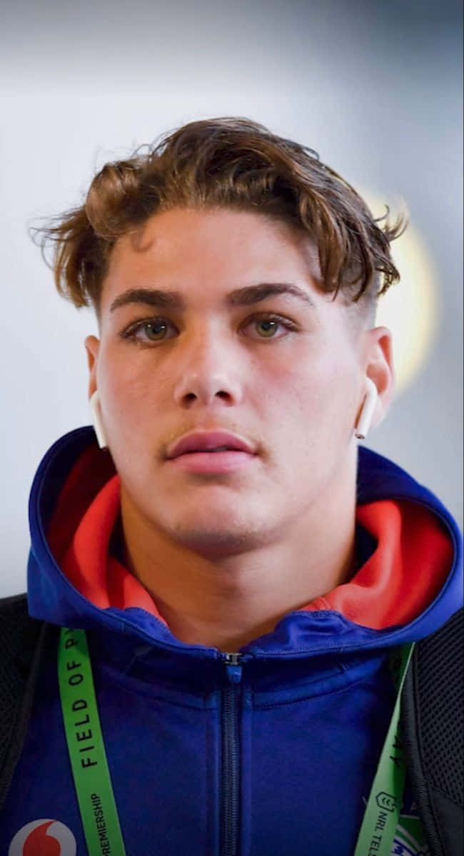 Reece Walsh, curly brown hair, white earbuds, SD Phone Wallpaper