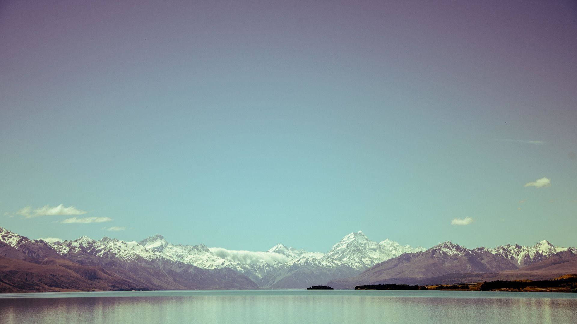 serene lake, snow-capped mountains, clear blue sky, Full HD Desktop Wallpaper