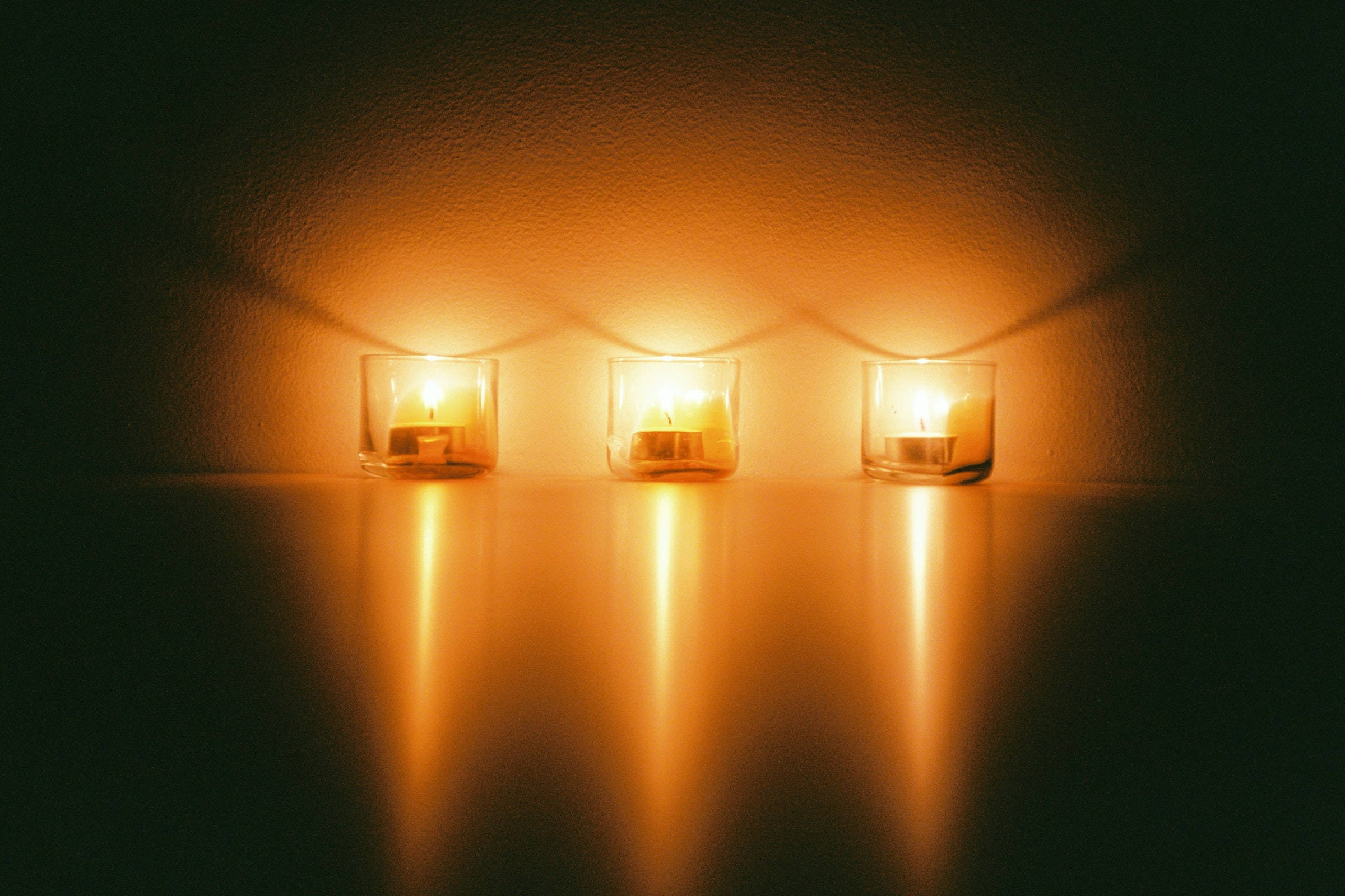 lit candles, tea lights, glass holders, Full HD Desktop Wallpaper
