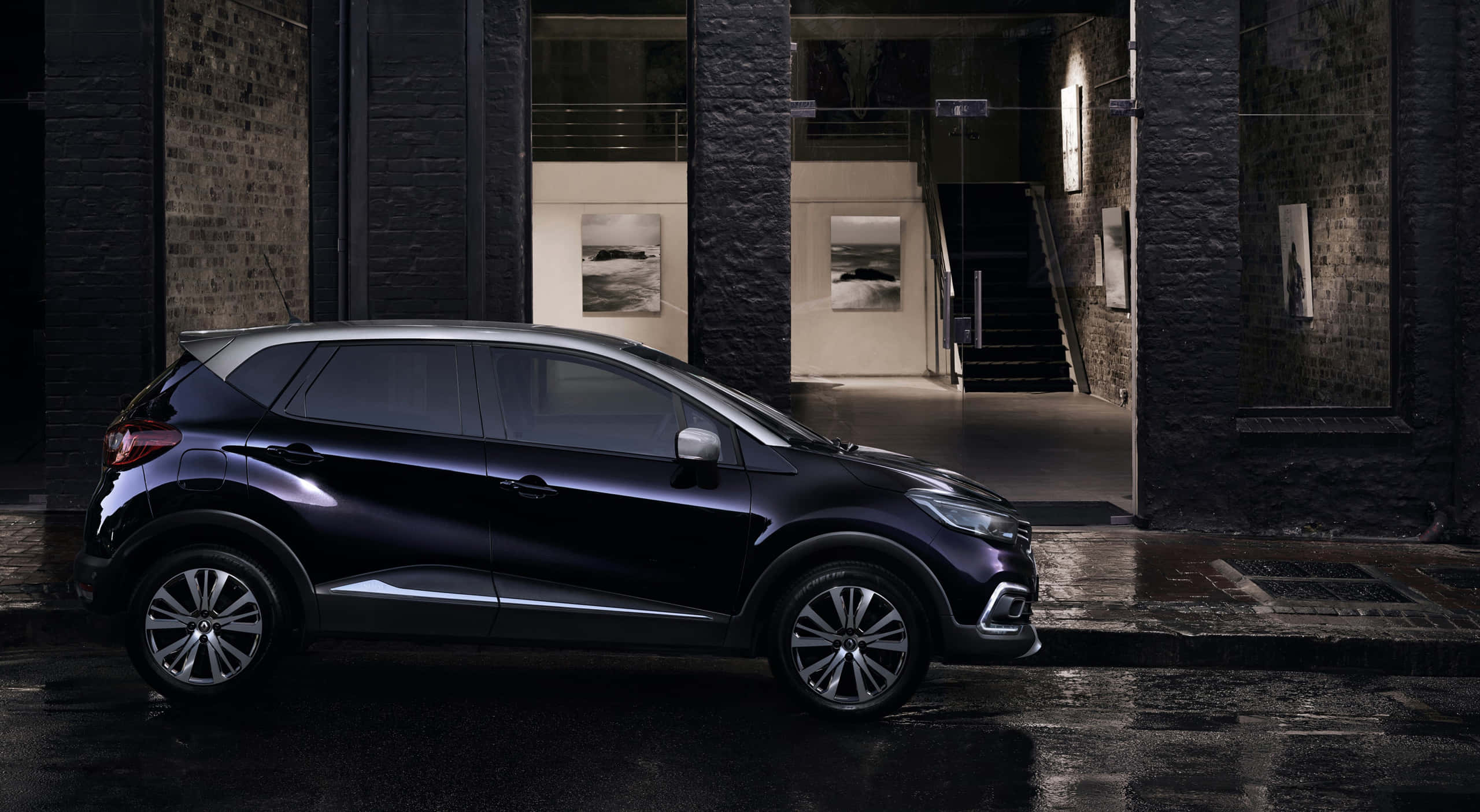 Renault Captur, sleek black SUV, wet urban street, 2K Desktop Wallpaper