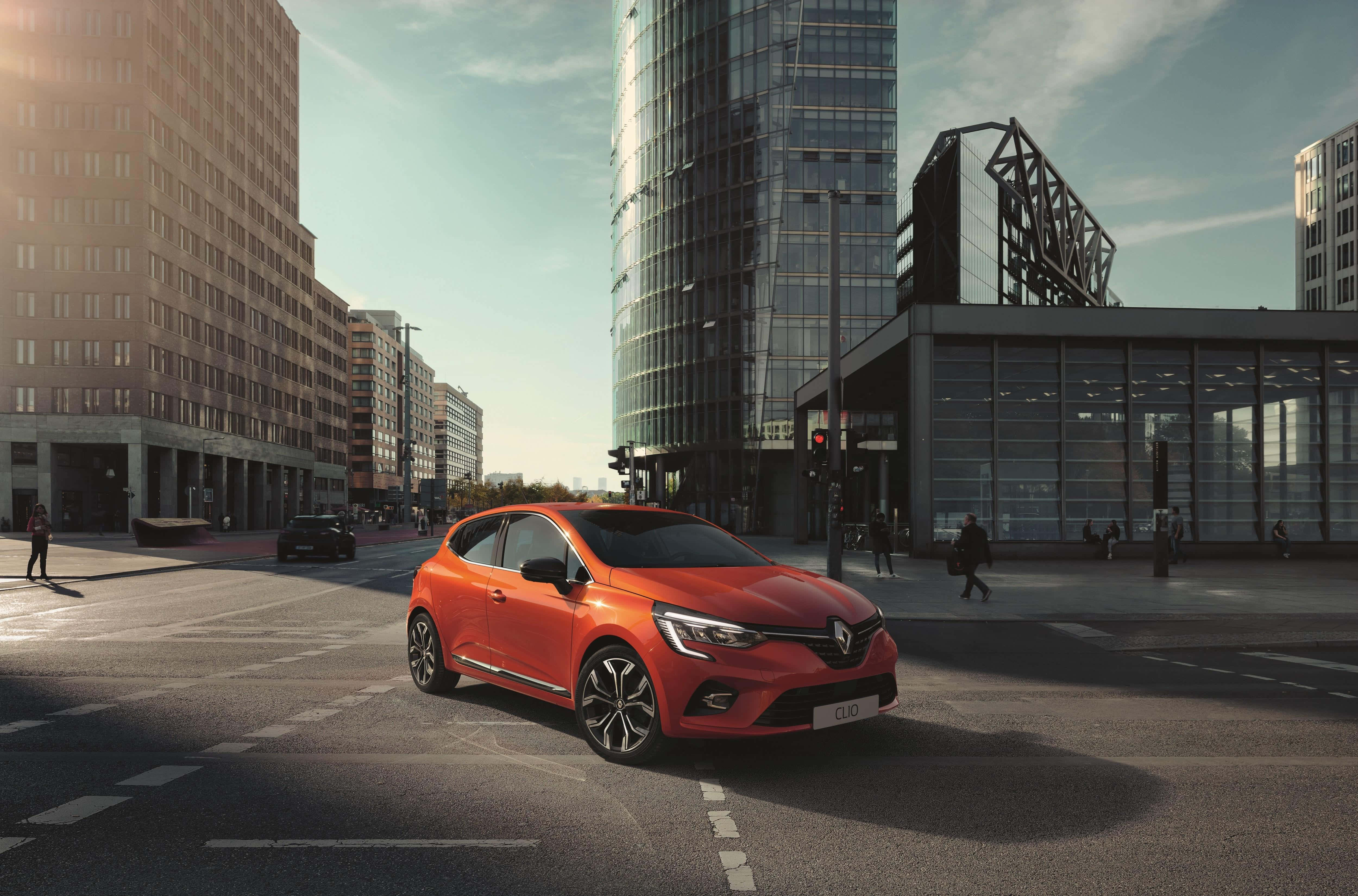 Renault Clio, vibrant orange, modern urban street, 4K Desktop Wallpaper