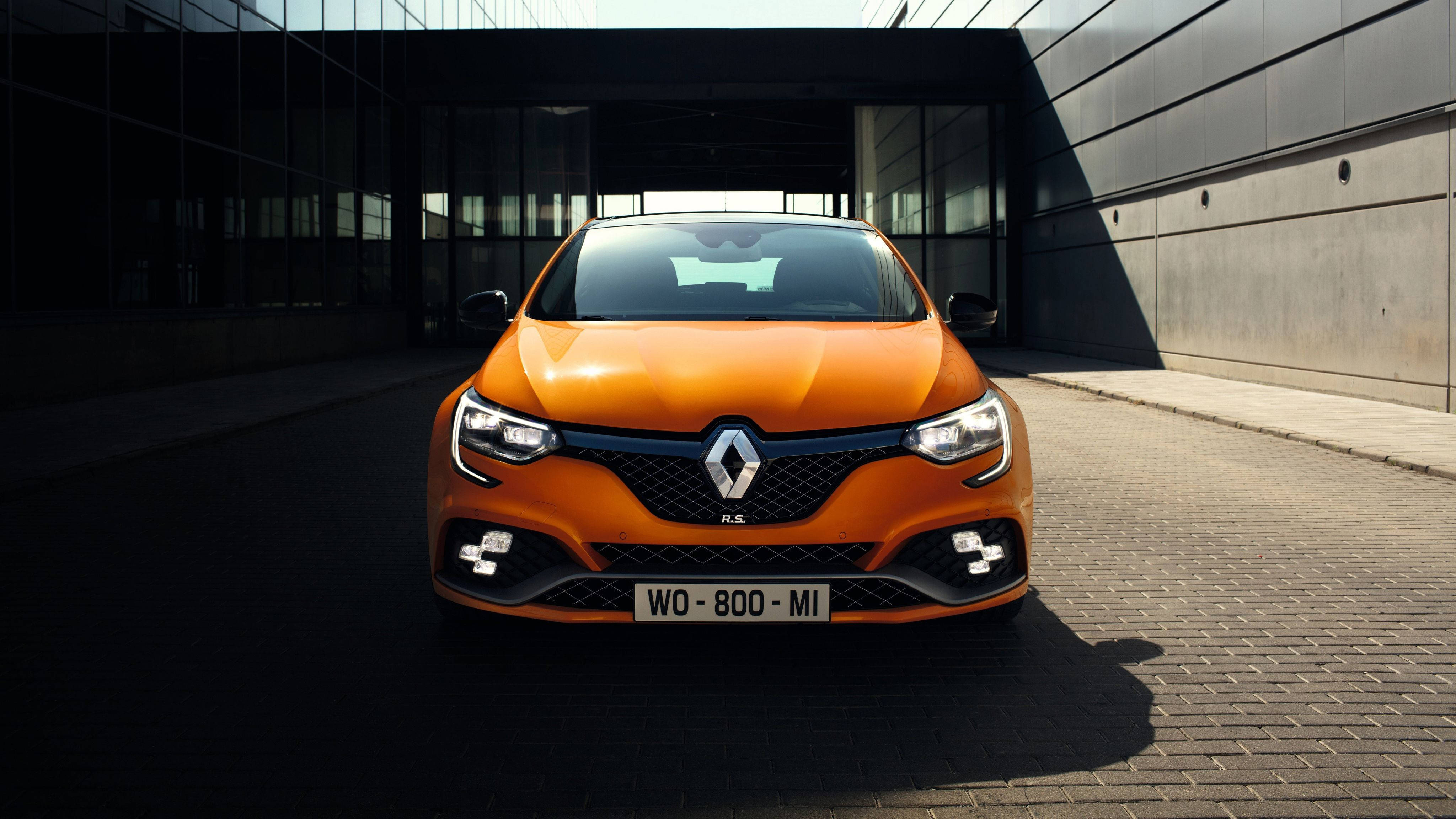 Renault Megane R.S., vibrant orange, modern glass and concrete structure, 4K Desktop Wallpaper
