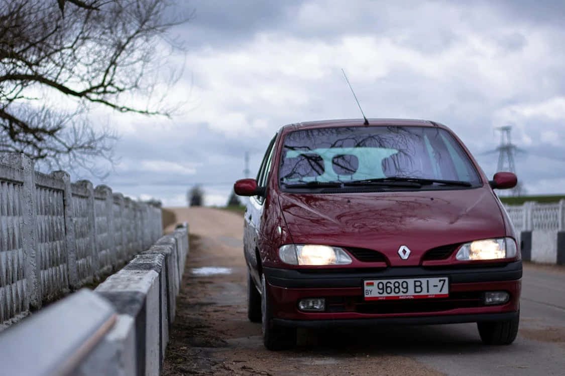 Red Renault Scenic, country road, weathered concrete barrier, SD Desktop Wallpaper