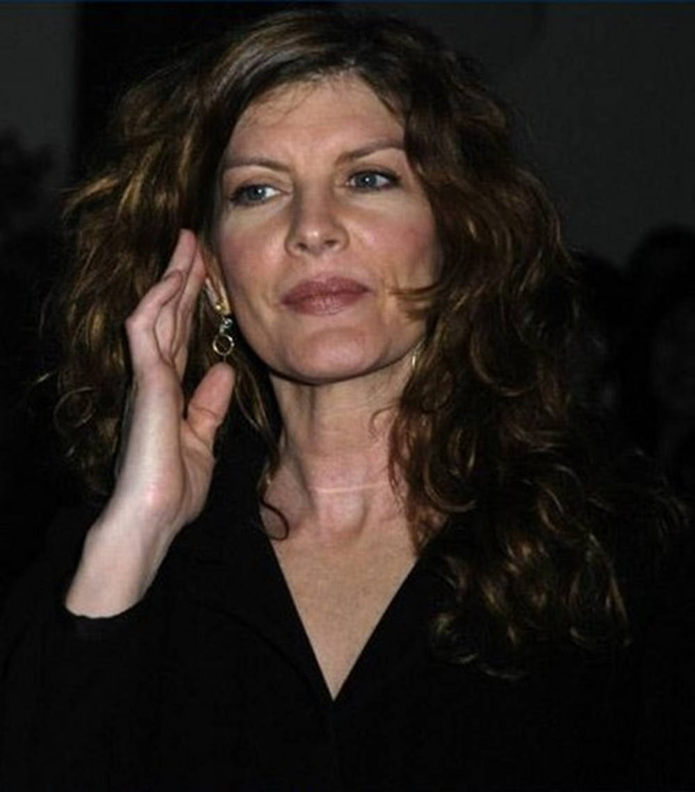 Rene Russo, wavy brown hair, black top, SD Phone Wallpaper