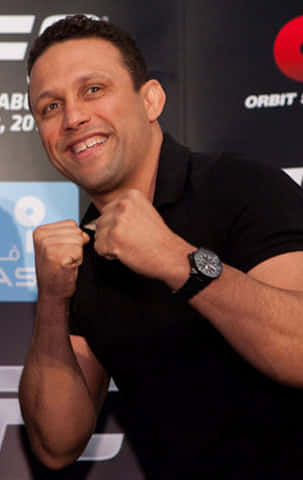 Renzo Gracie, black polo shirt, fists raised, SD Phone Wallpaper
