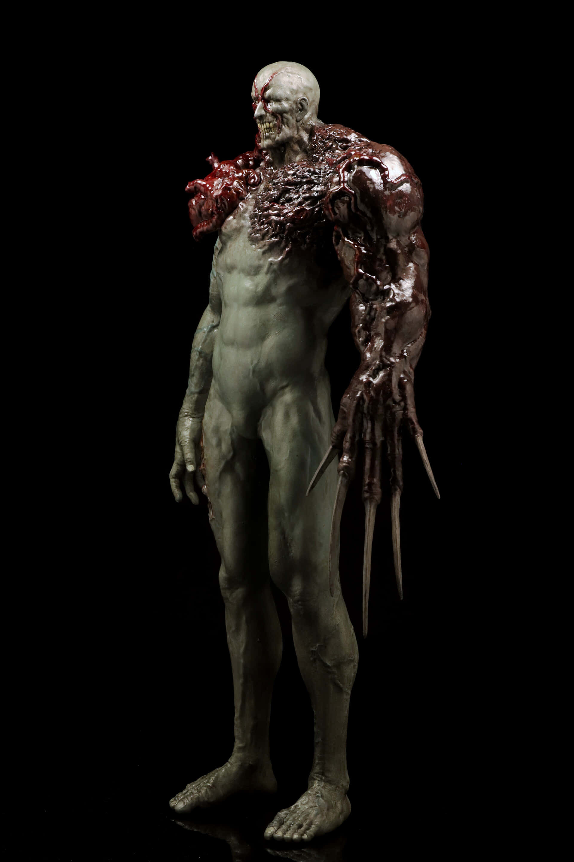 Resident Evil Tyrant, grotesque humanoid figure, exposed muscle tissue, 2K Phone Wallpaper