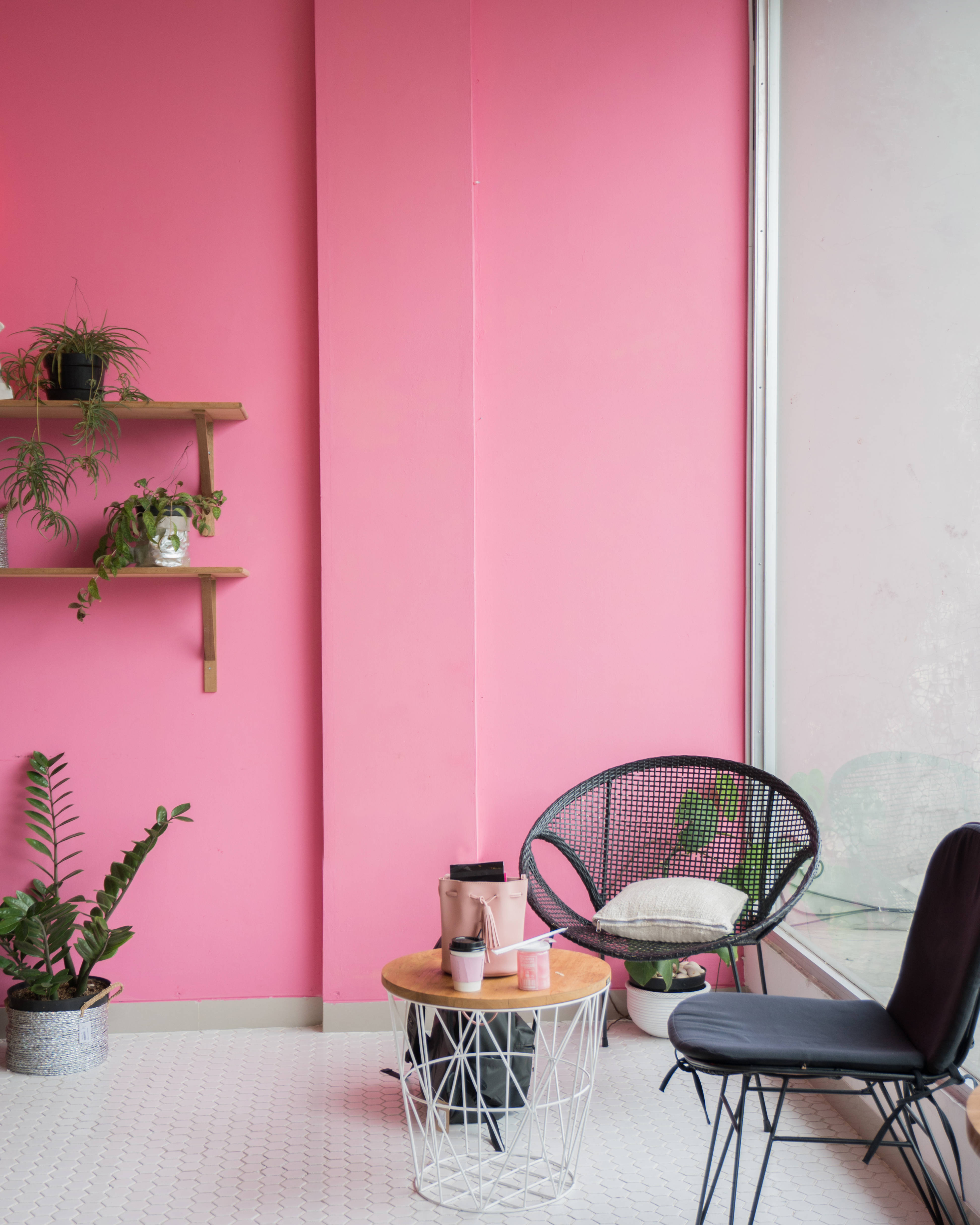 kawaii pink wall, black wicker chair, wooden table, 4K Phone Wallpaper