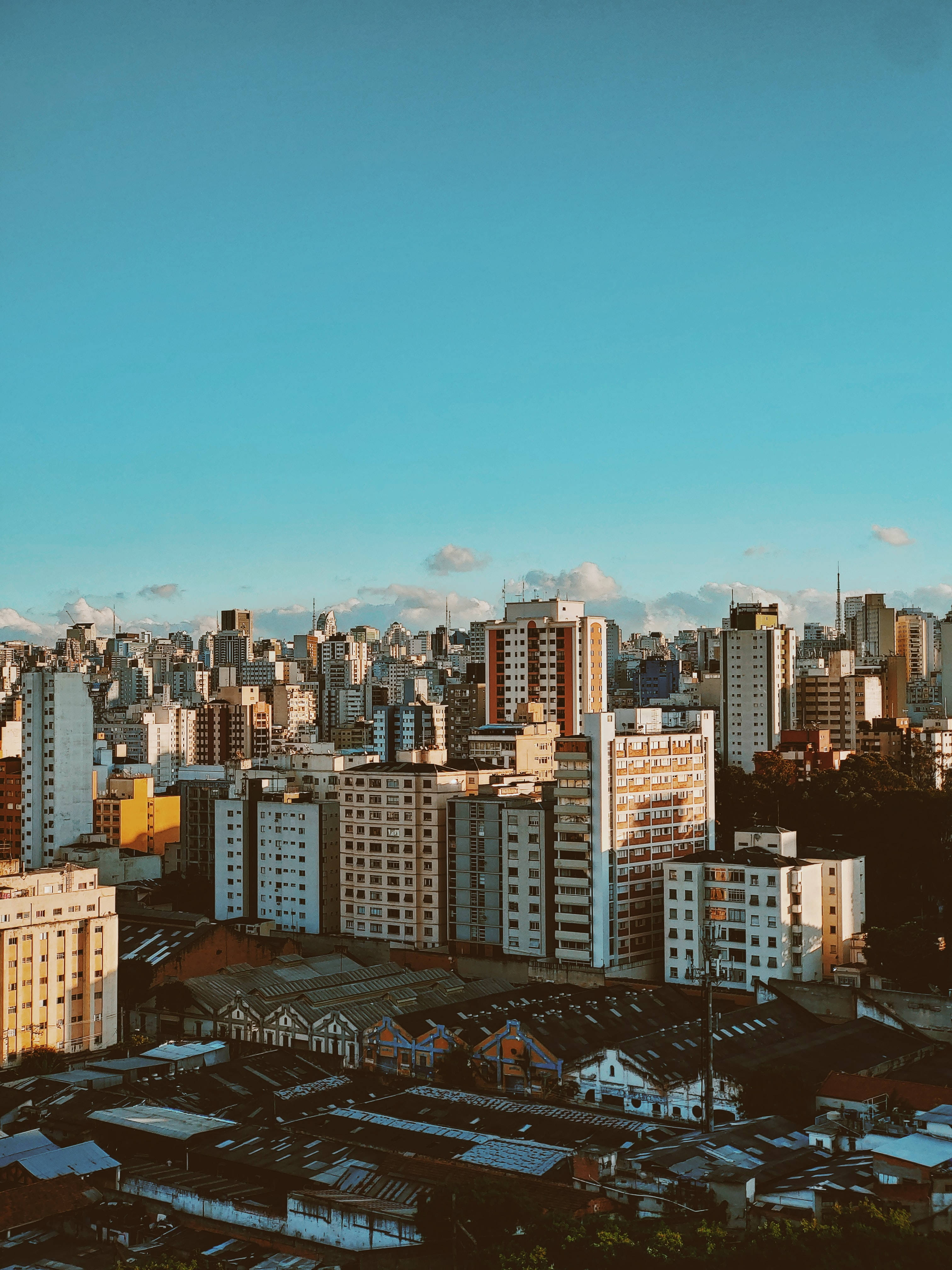 Vintage City, golden sunset light, towering buildings, 4K Phone Wallpaper