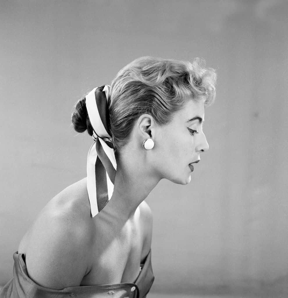 vintage black and white portrait, woman in profile, ribbon tied in her hair, SD Phone Wallpaper