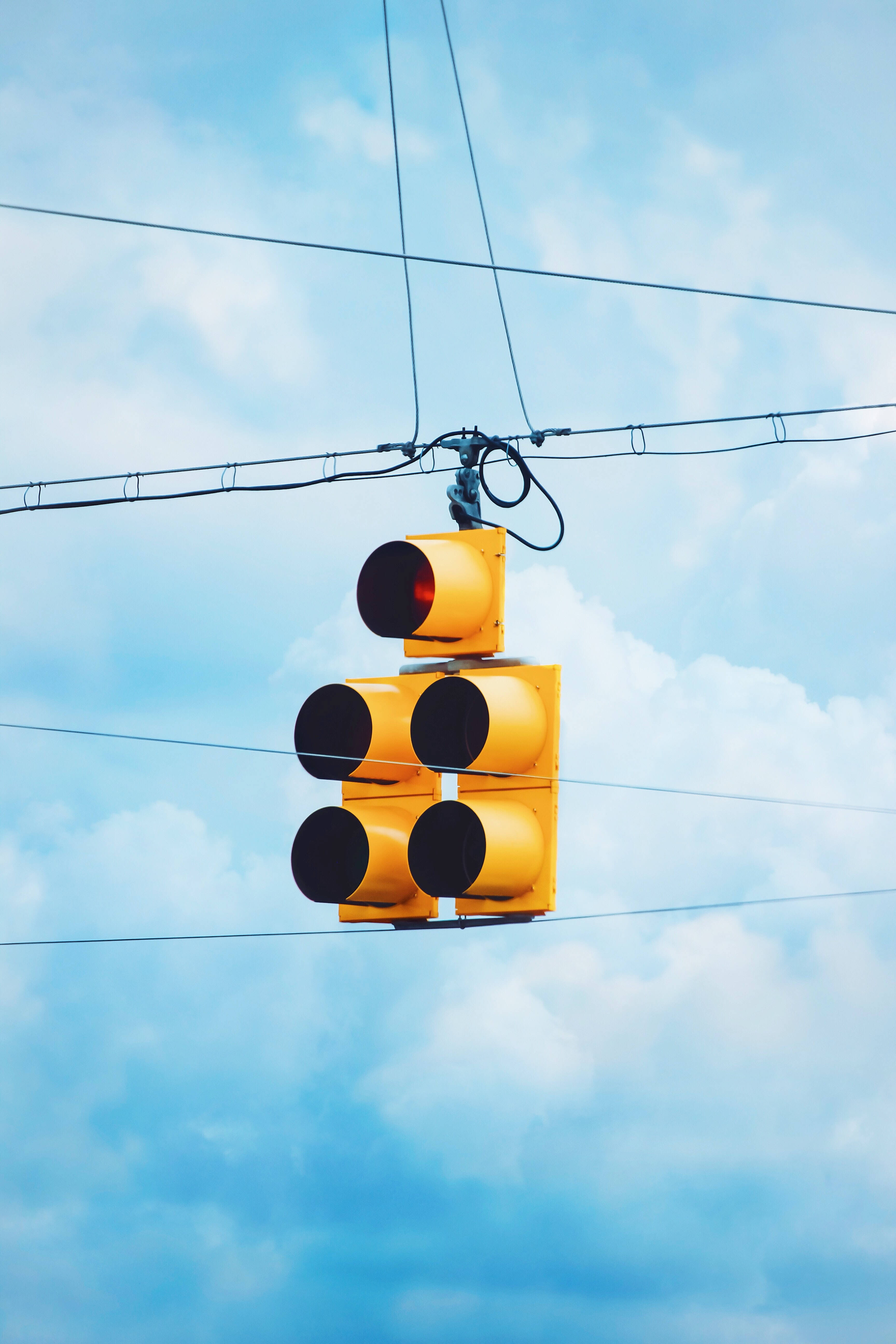 yellow traffic light, bright blue sky, fluffy white clouds, 5K Phone Wallpaper