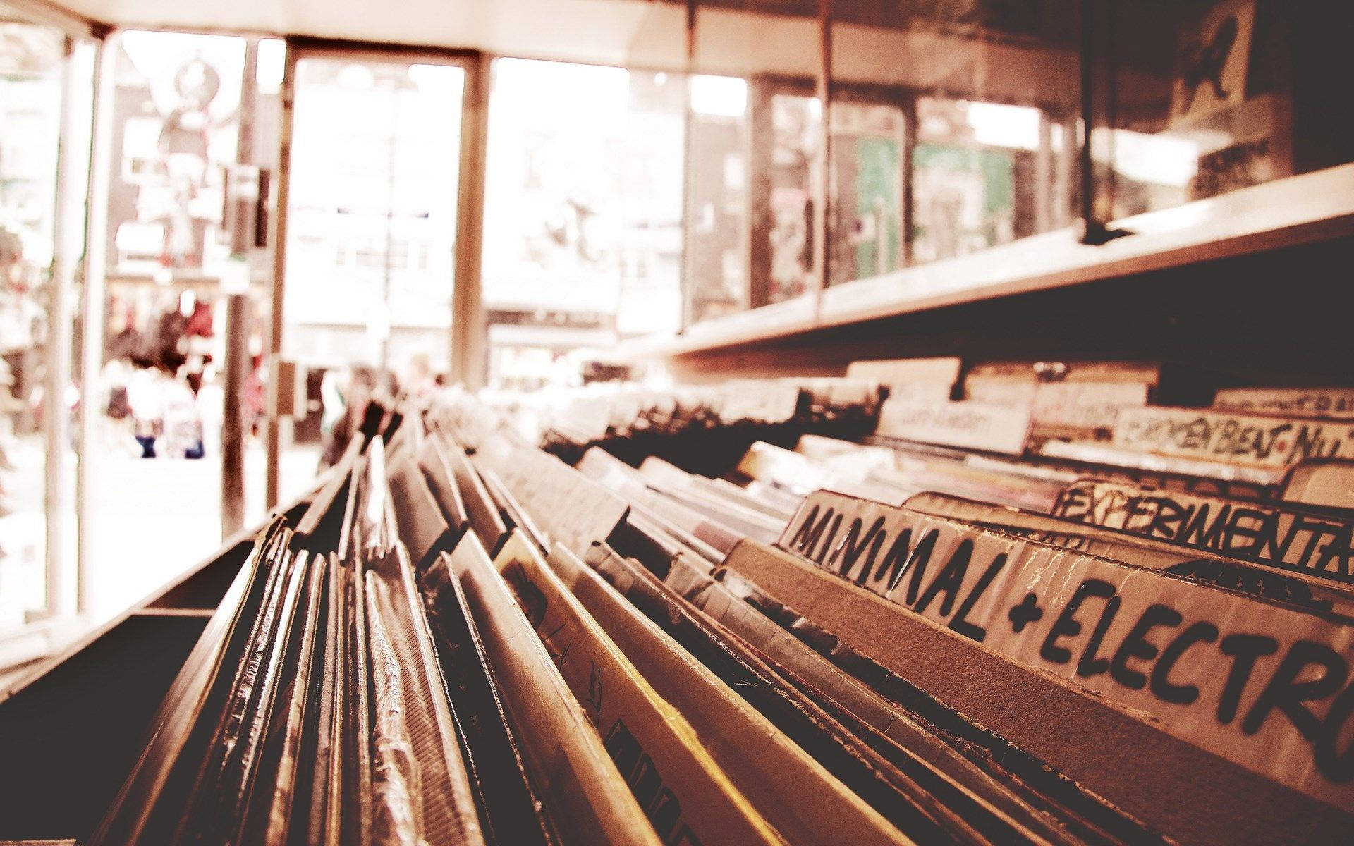 vintage vinyl record store, rows of vinyl records, warm sepia tones, Full HD Desktop Wallpaper