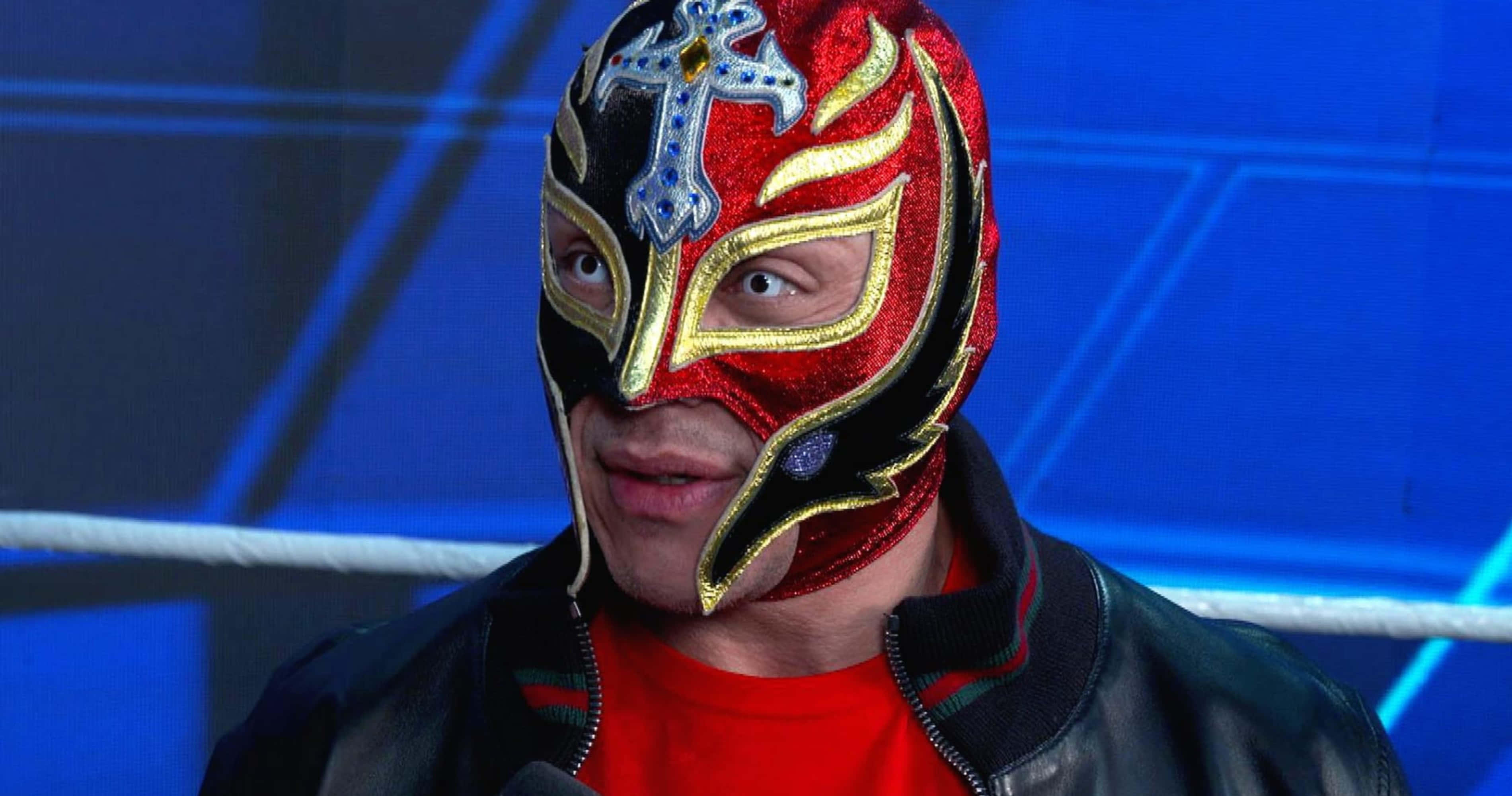 Rey Mysterio, red black and gold ornate mask, blue lit ring, 2K Desktop Wallpaper