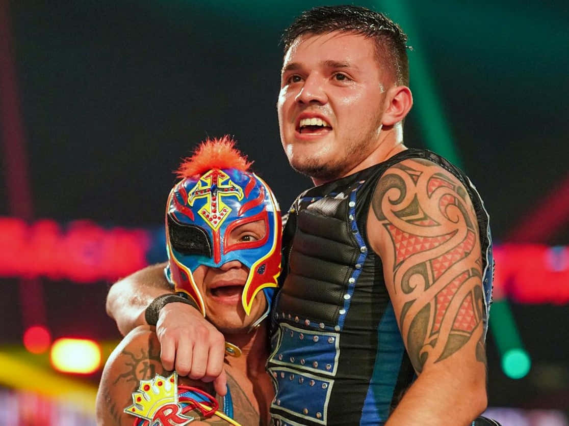 Rey Mysterio, colorful mask with red feather, tribal tattooed arm, SD Desktop Wallpaper