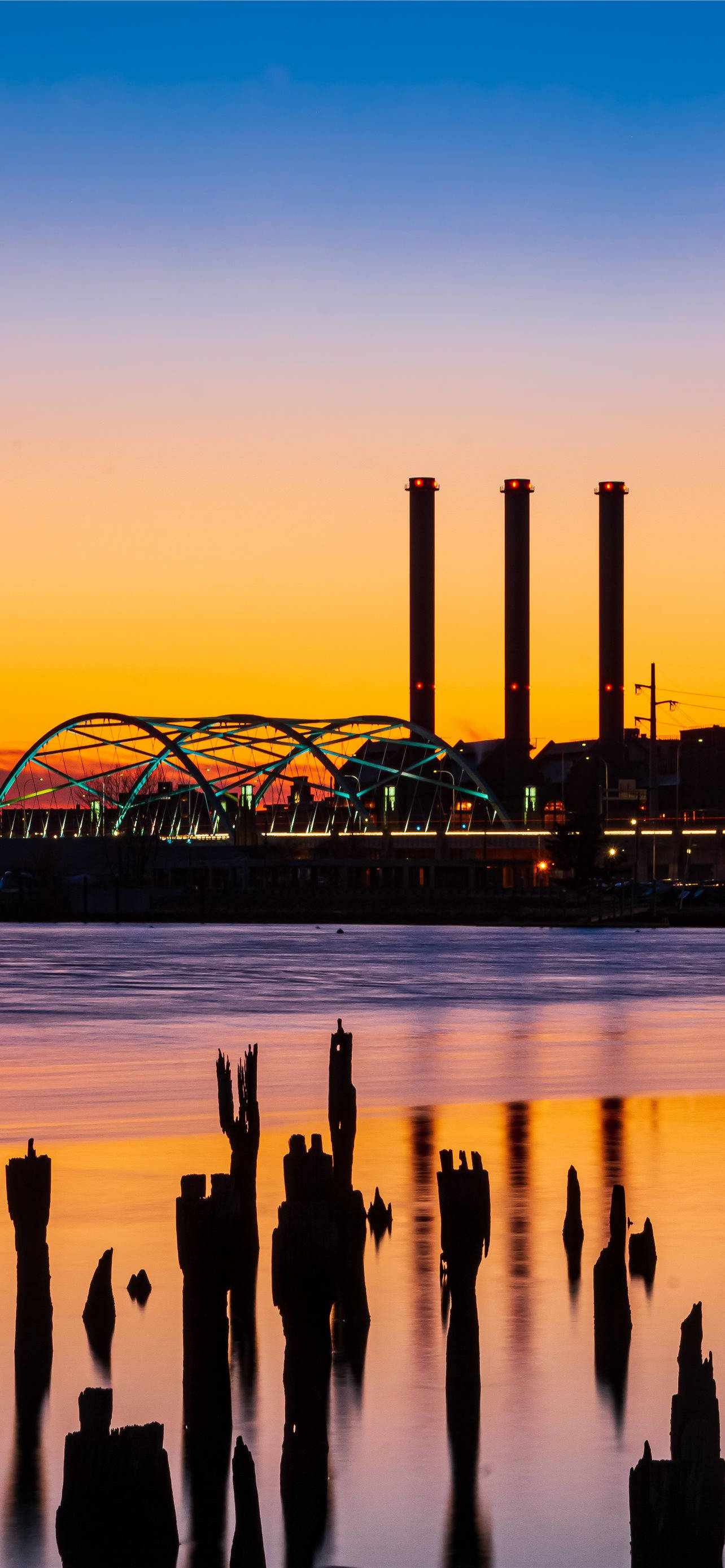 kaleidoscopic sunset, Rhode Island park, industrial smokestacks, 2K Phone Wallpaper