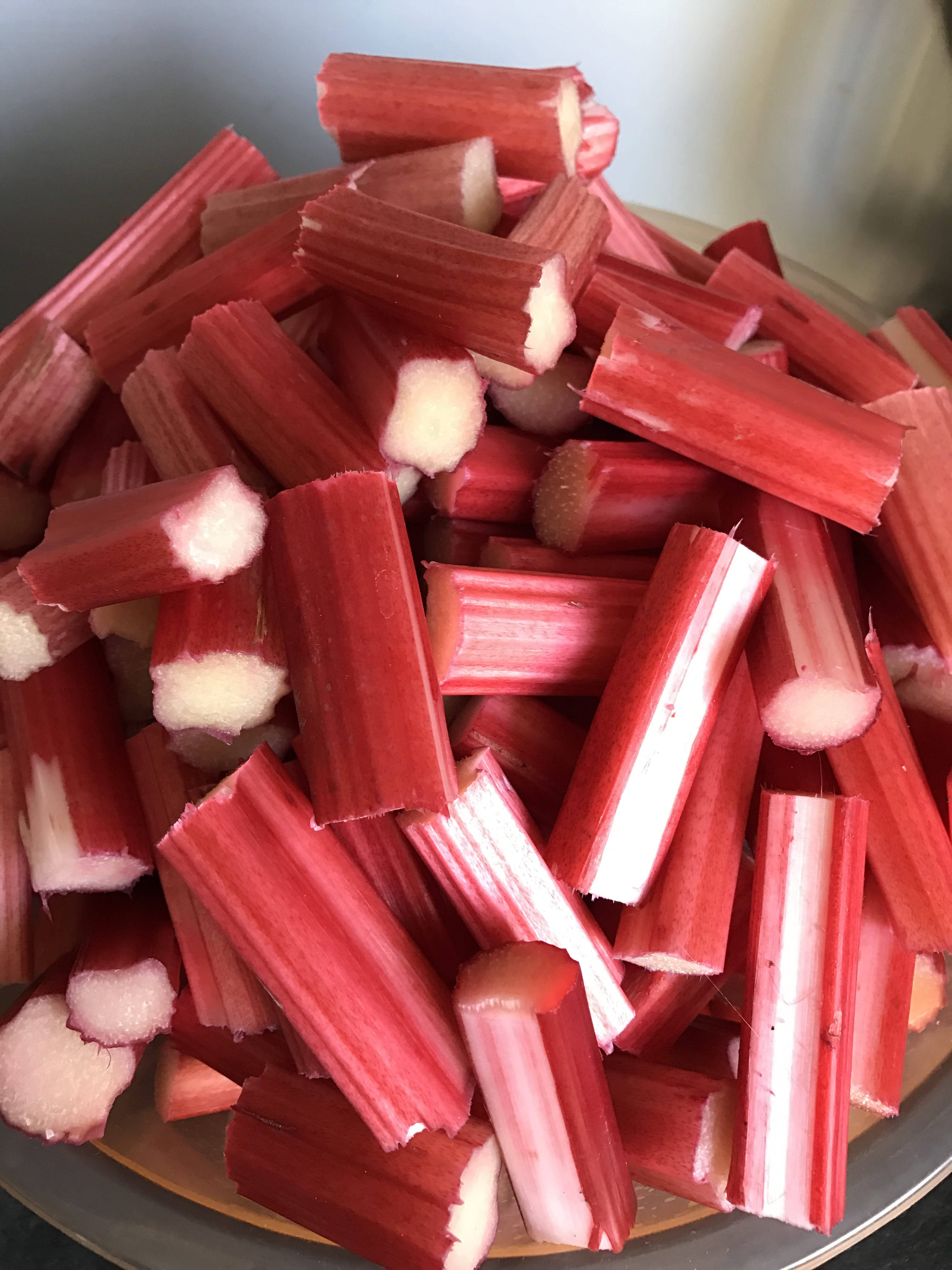 Canadian red chopped rhubarb, vibrant red exteriors, pale white interiors, 4K Phone Wallpaper