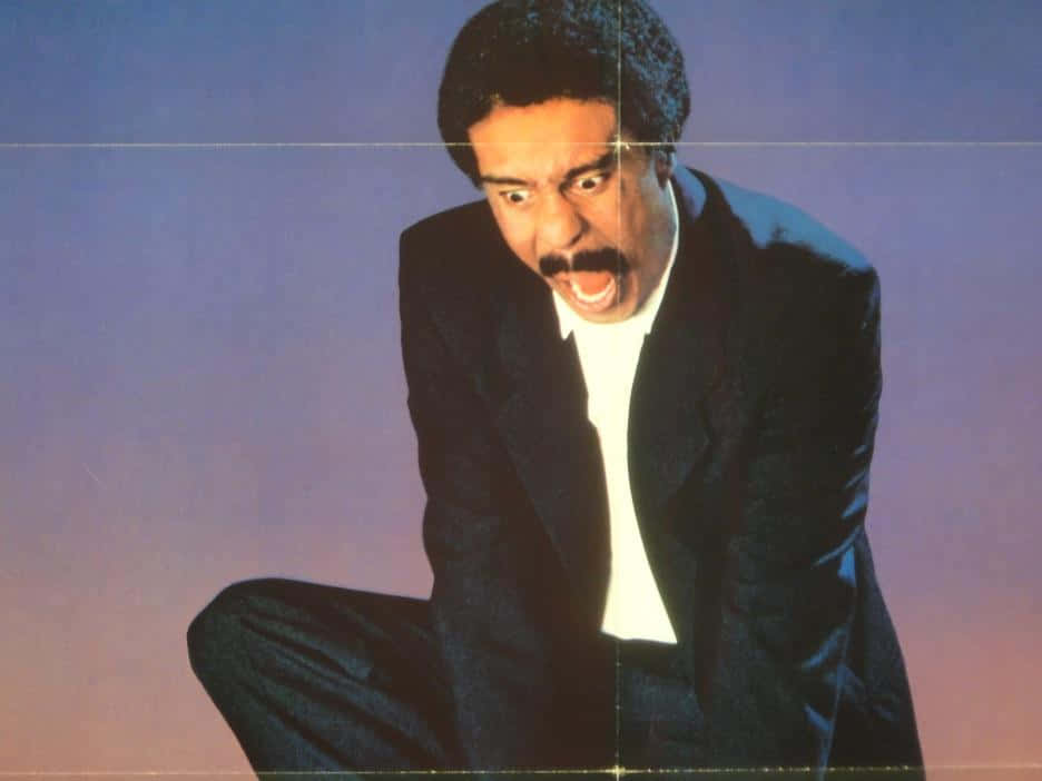 Richard Pryor, dark suit, gradient purple and pink background, SD Desktop Wallpaper