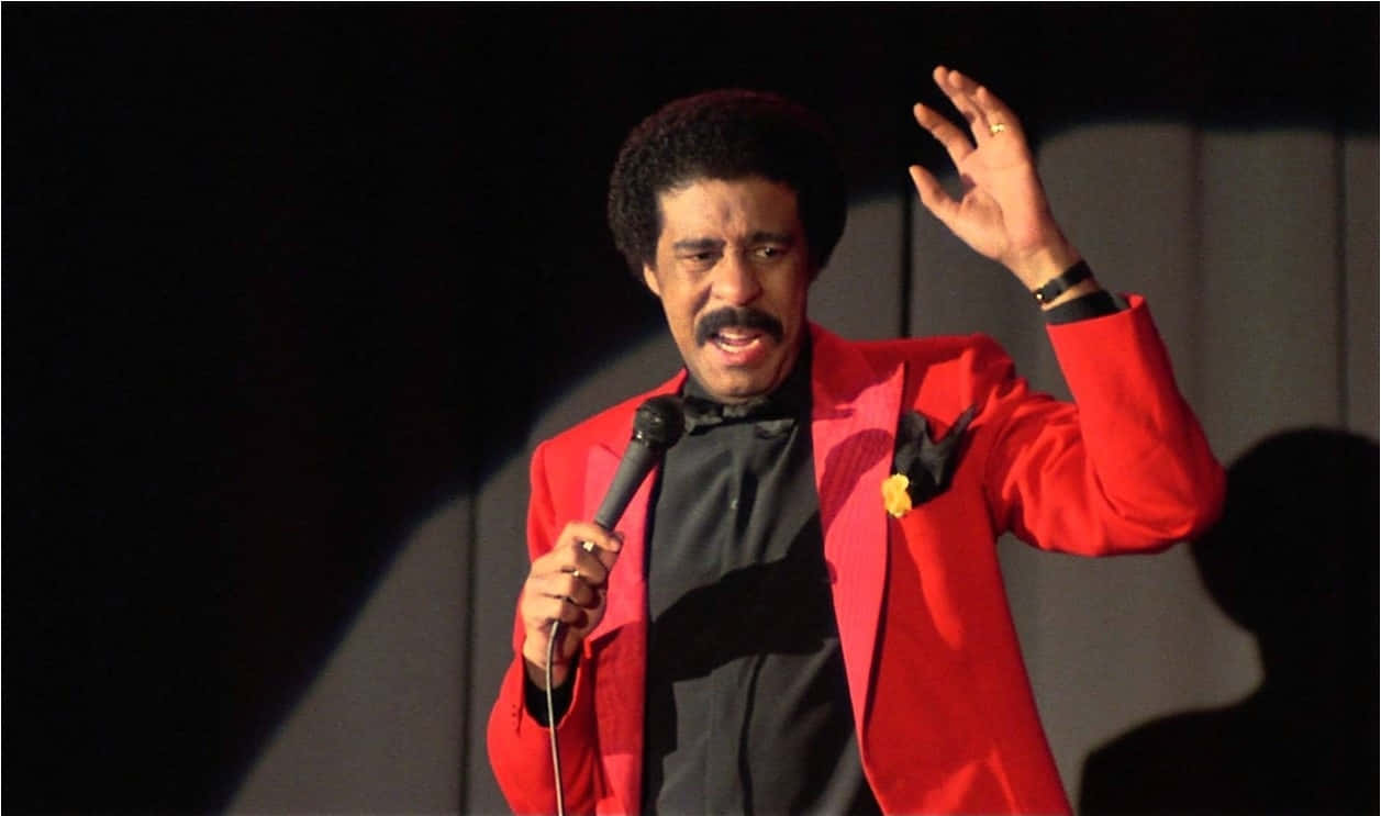 Richard Pryor, vibrant red suit, microphone, SD Desktop Wallpaper
