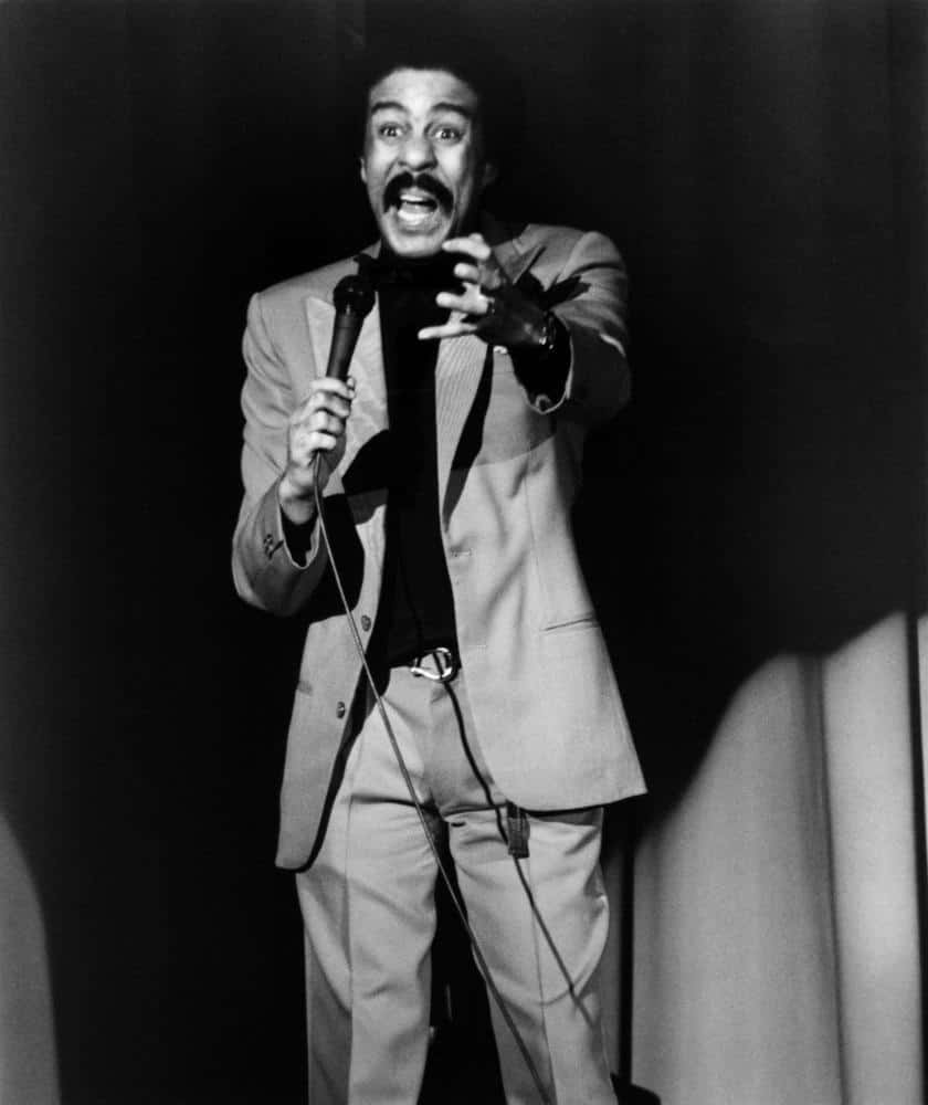 Richard Pryor, black and white photo, mustachioed performer, SD Phone Wallpaper