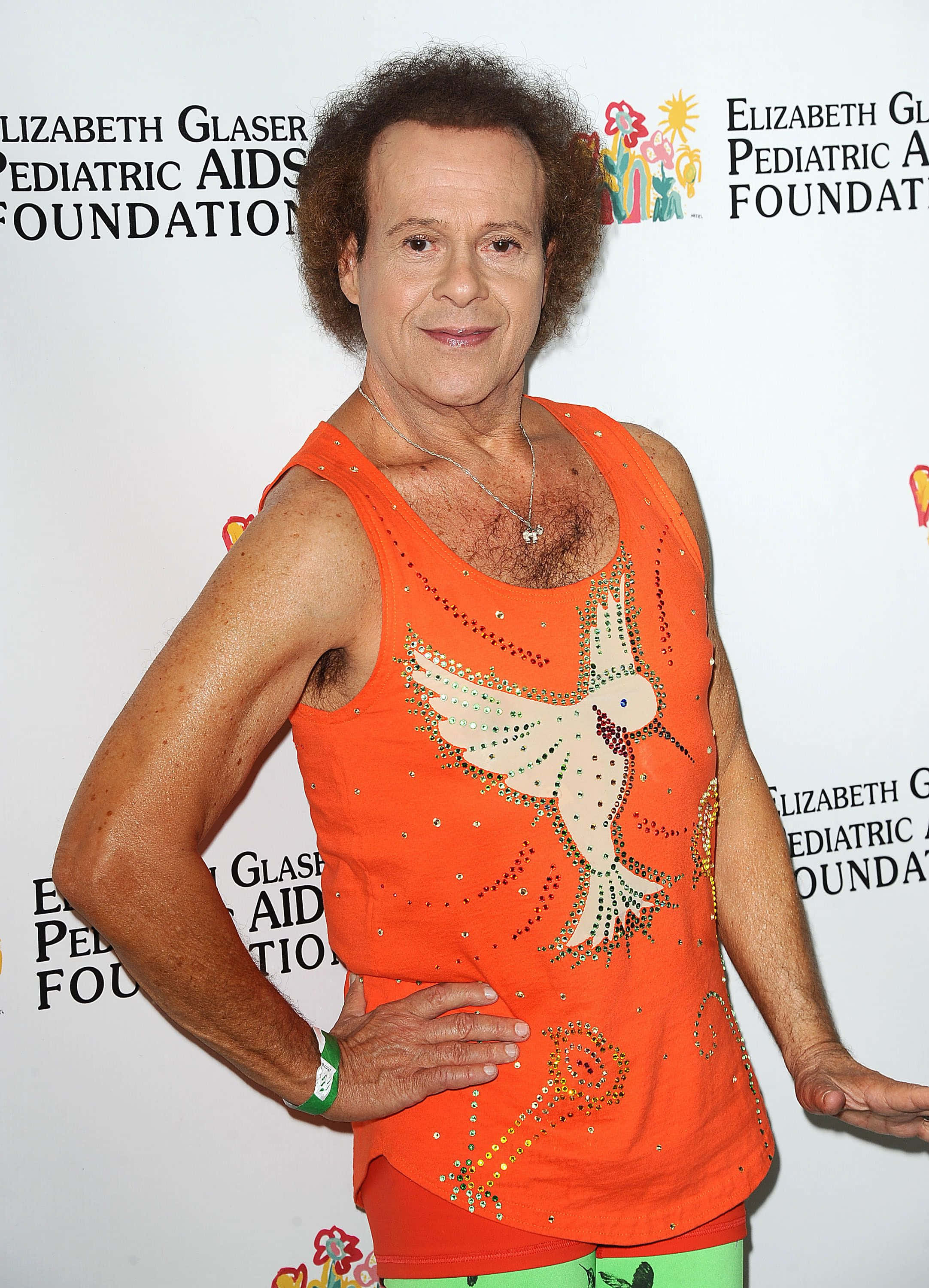 Richard Simmons, bright orange tank top, bejeweled dove design, 2K Phone Wallpaper