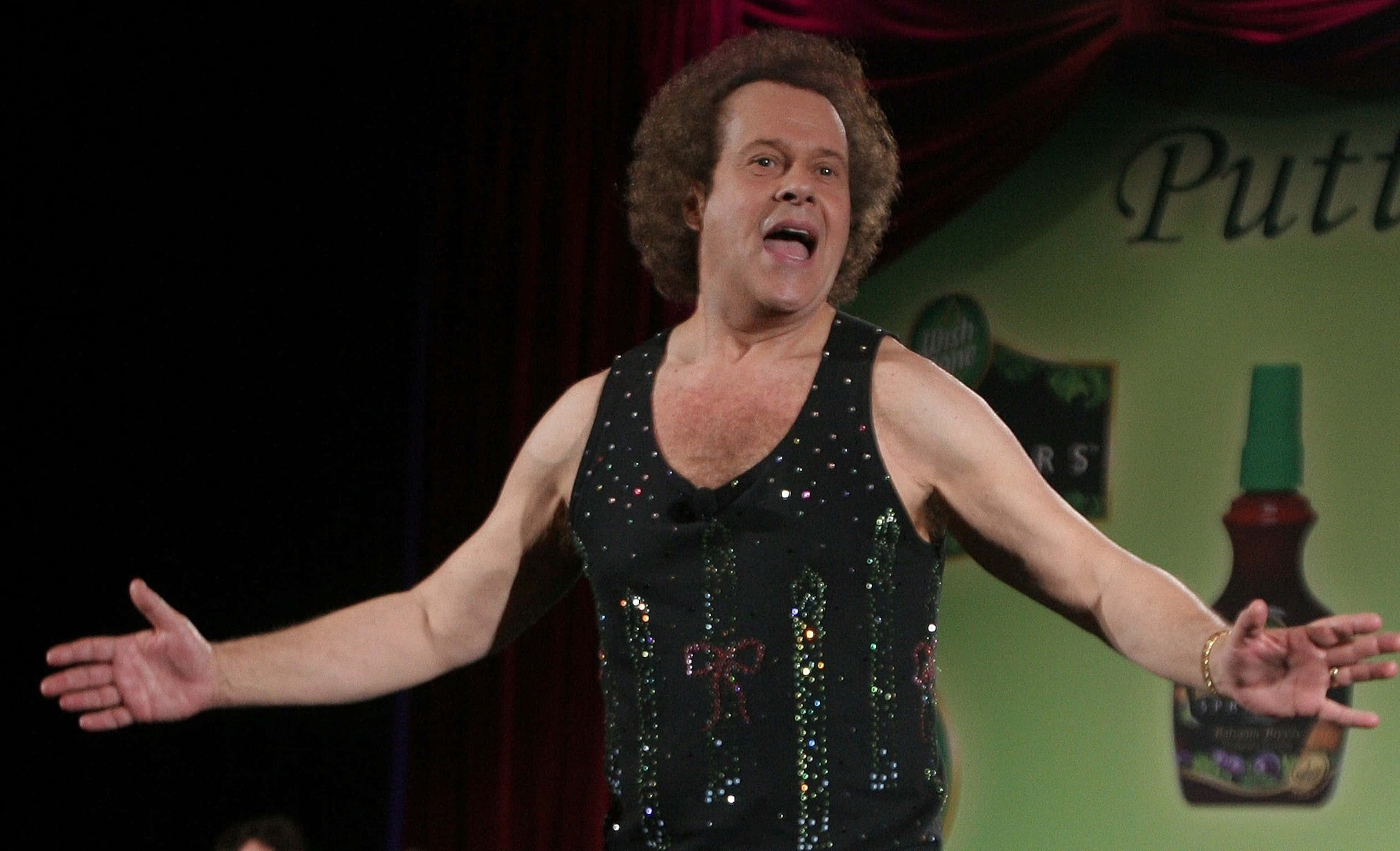 Richard Simmons, sequined black tank top, bottle, 2K Desktop Wallpaper