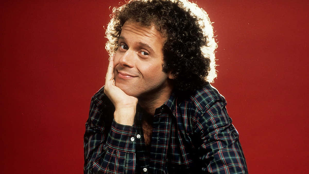 Richard Simmons, plaid shirt, solid red background, SD Desktop Wallpaper