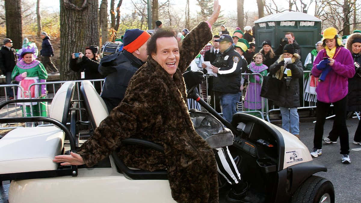 Richard Simmons, brown leopard print jumpsuit, white golf cart, SD Desktop Wallpaper