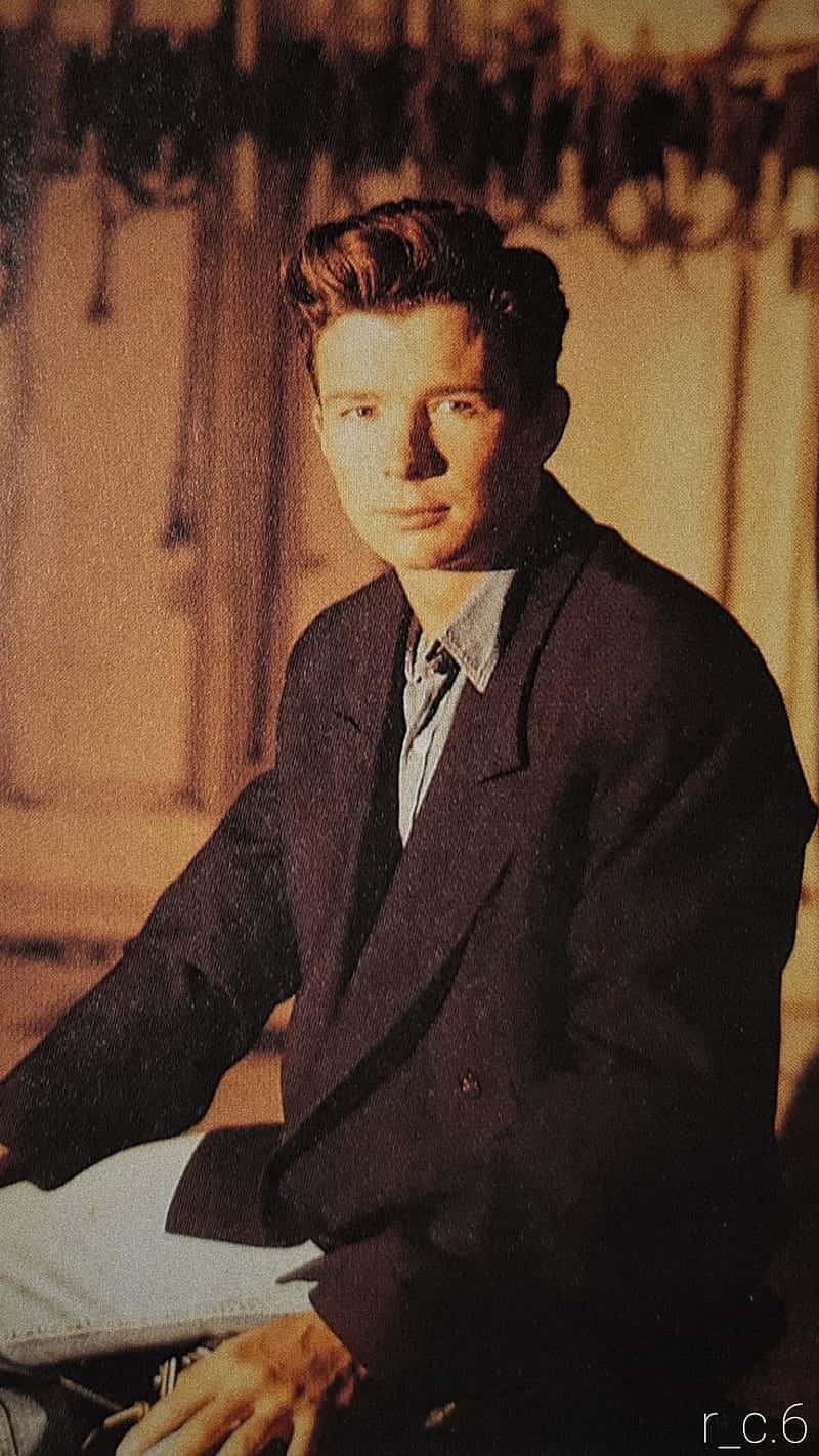 Rick Astley, dark suit, warm vintage lighting, HD Phone Wallpaper