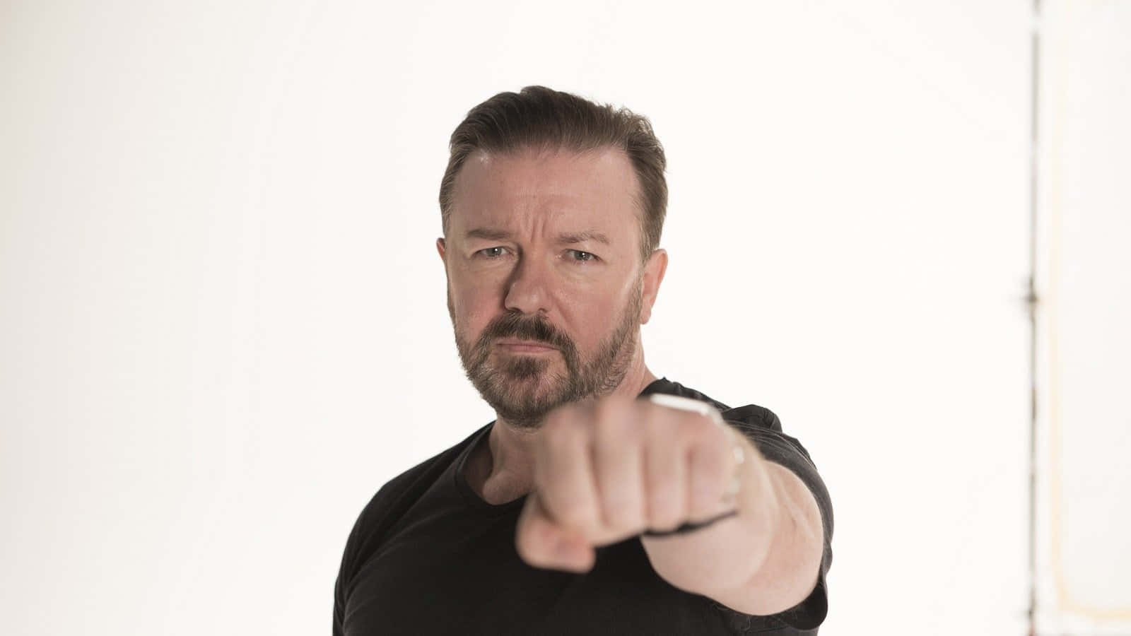 Ricky Gervais, black shirt, stark white background, HD Desktop Wallpaper