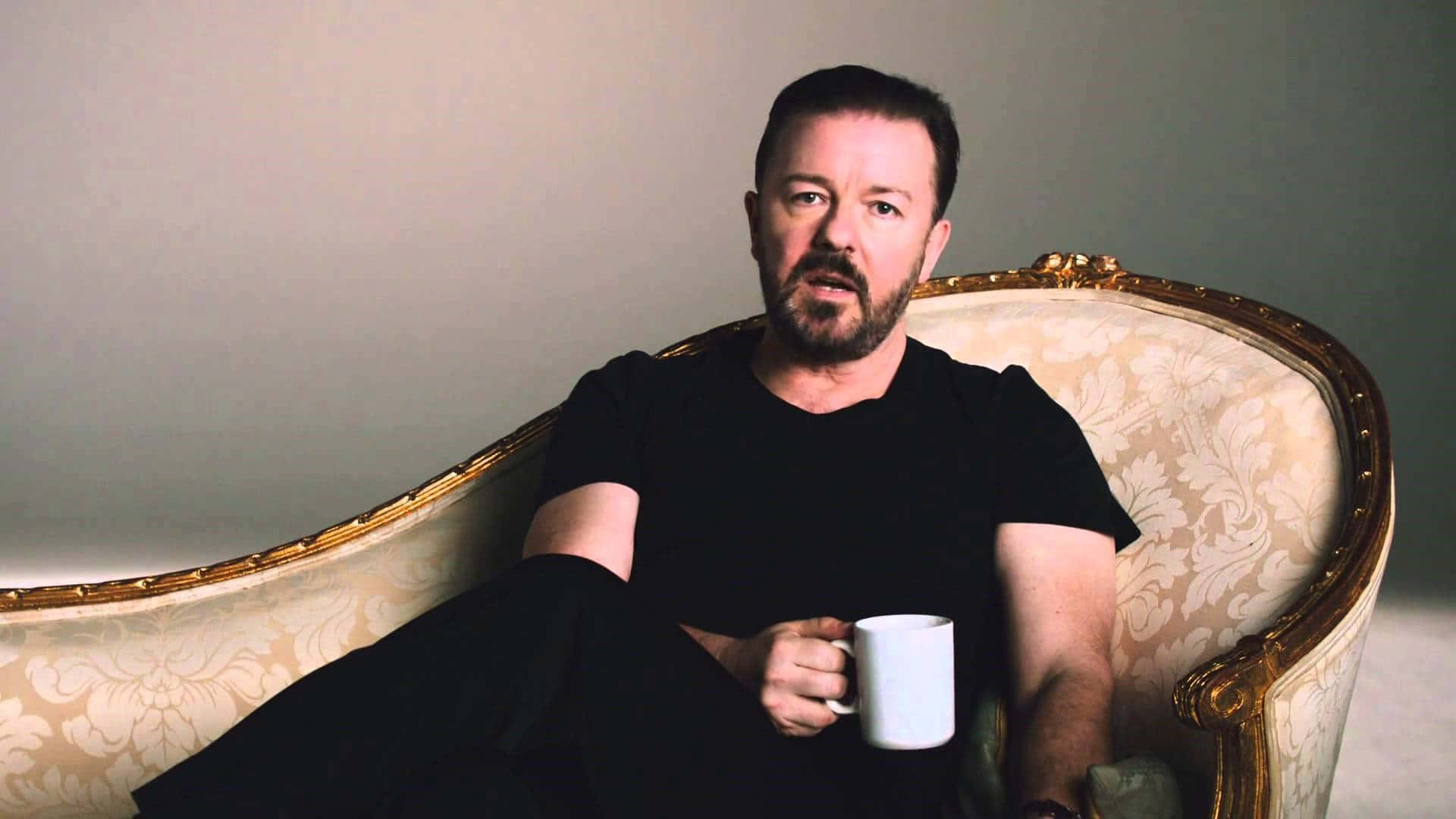 Ricky Gervais, gold-framed armchair, white mug, Full HD Desktop Wallpaper