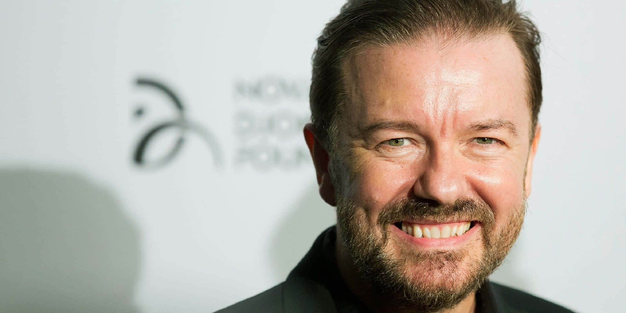 Ricky Gervais, black suit, white backdrop, Full HD Desktop Wallpaper