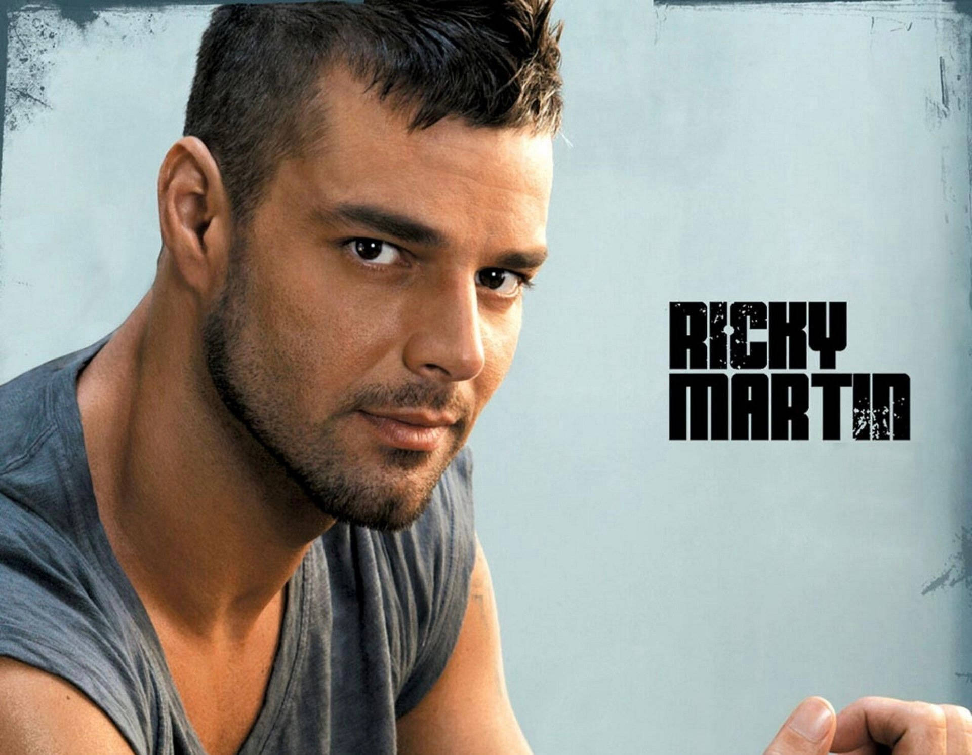 Ricky Martin, textured light blue background, bold black text, Full HD Desktop Wallpaper
