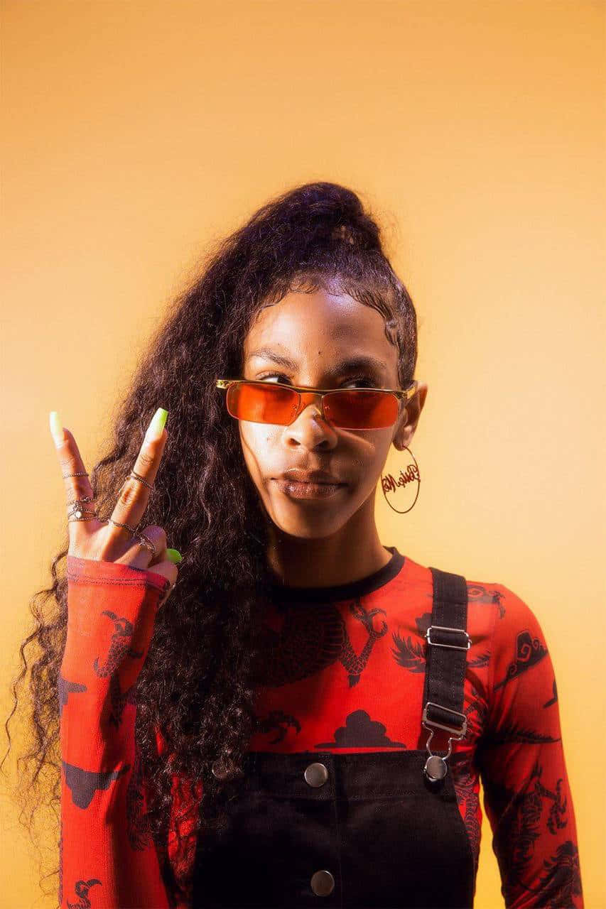 Rico Nasty, orange sunglasses, warm yellow background, HD Phone Wallpaper
