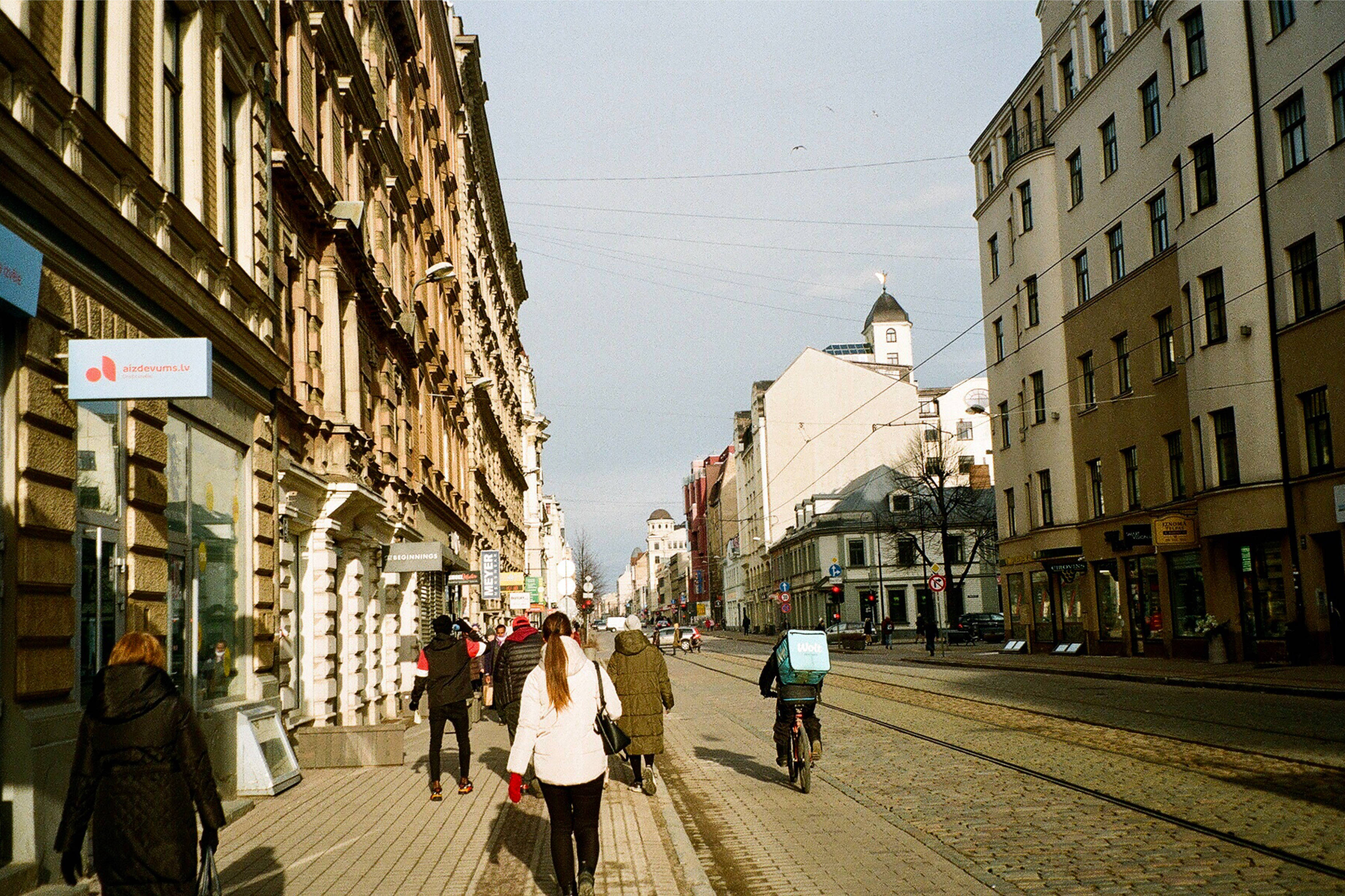Riga, cobblestone street, historic European buildings, 2K Desktop Wallpaper