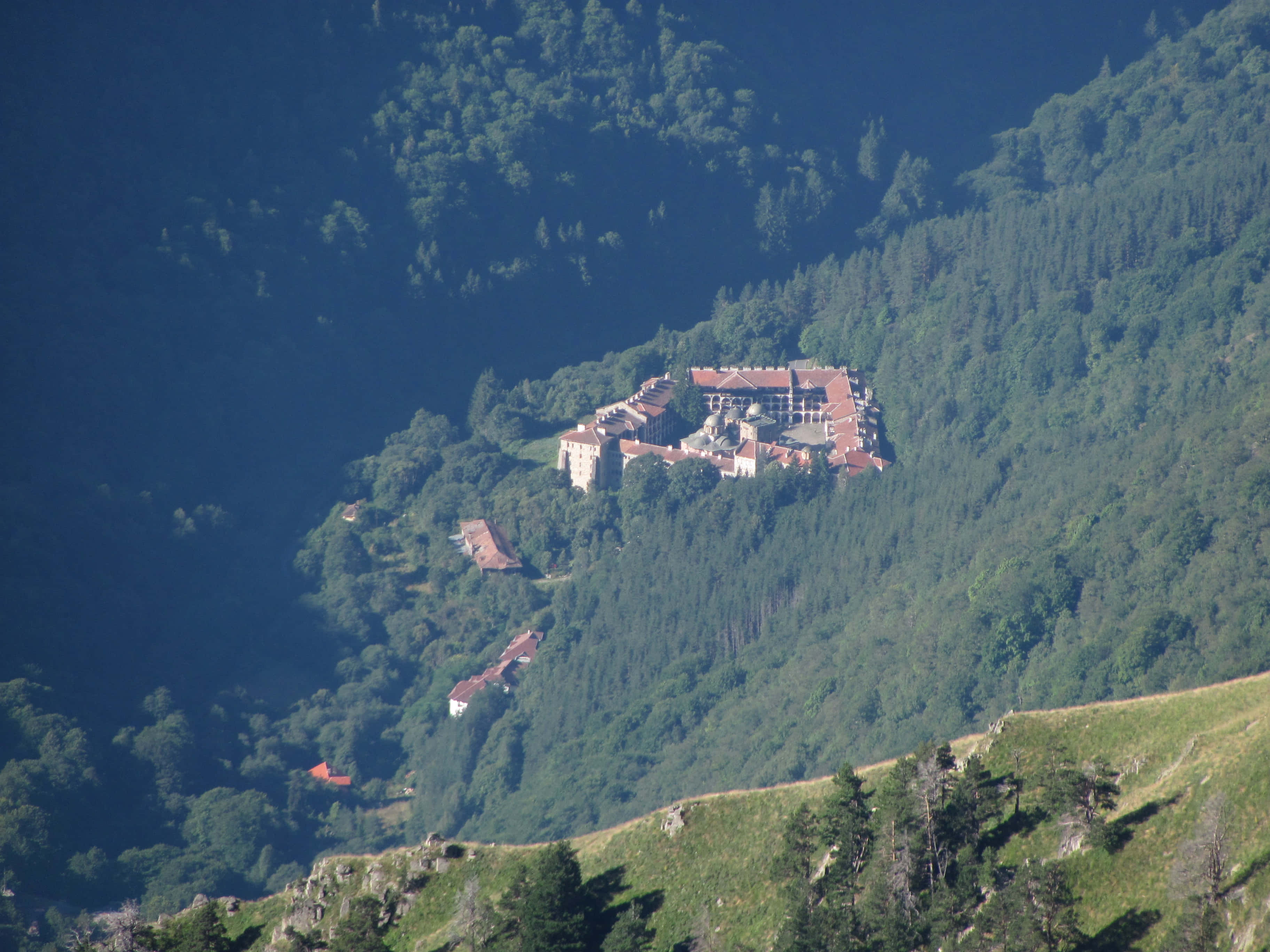 Rila Monastery, stone castle, red roofs, 2K Desktop Wallpaper
