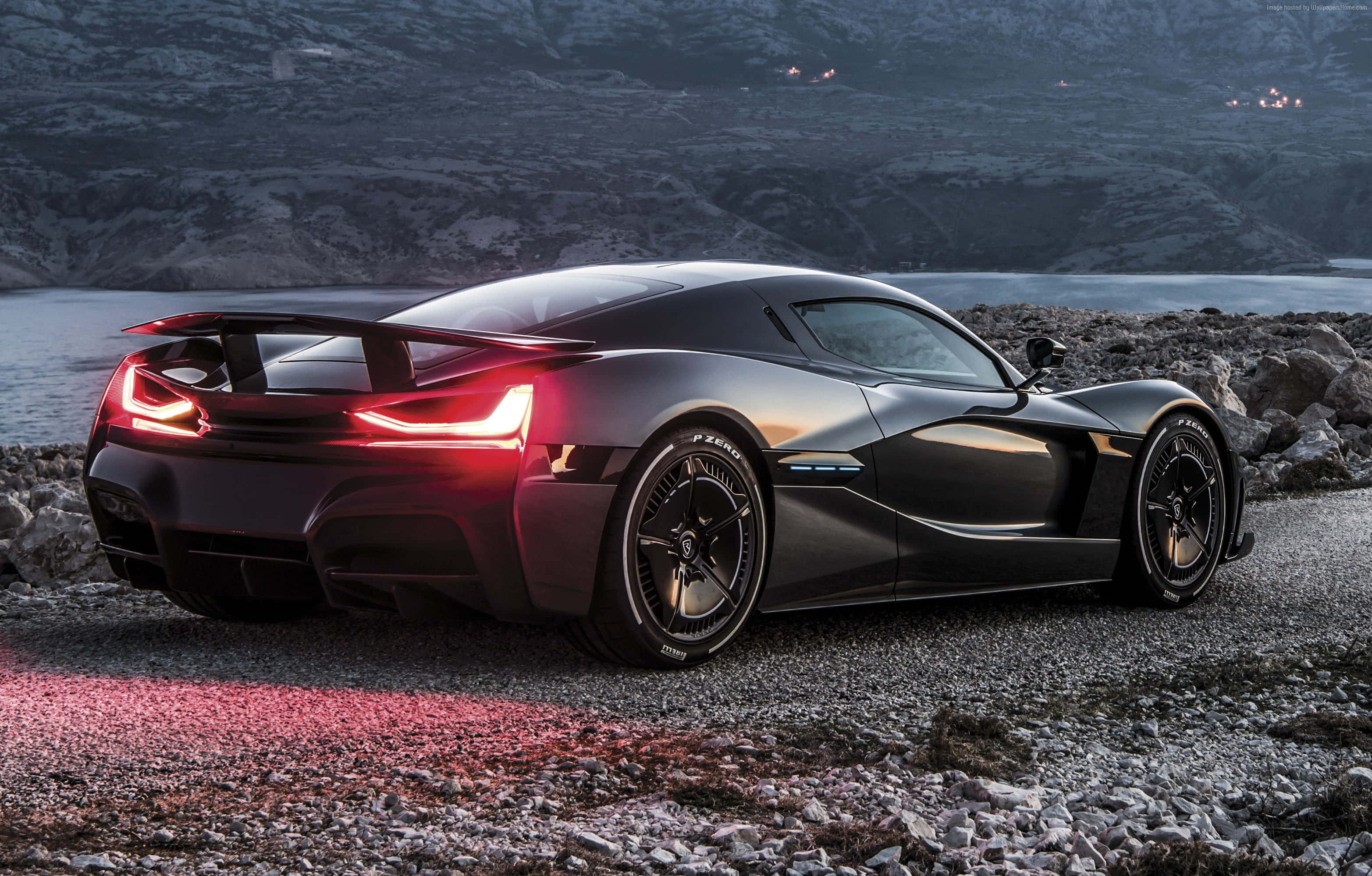 Rimac C Two, sleek black sports car, glowing red taillights, 2K Desktop Wallpaper