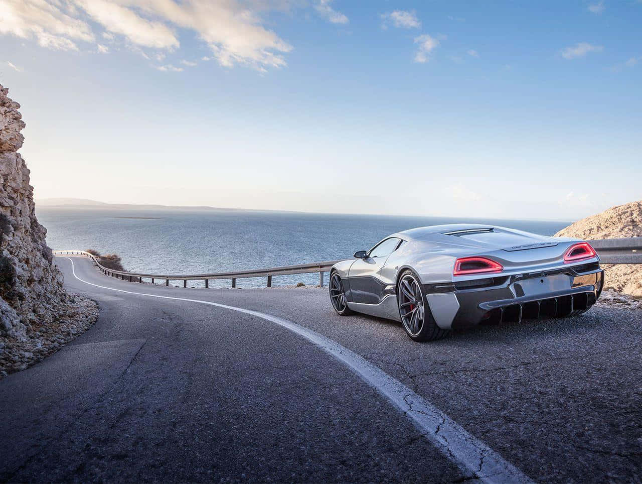 Rimac Concept One, sleek silver sports car, winding coastal road, HD Desktop Wallpaper