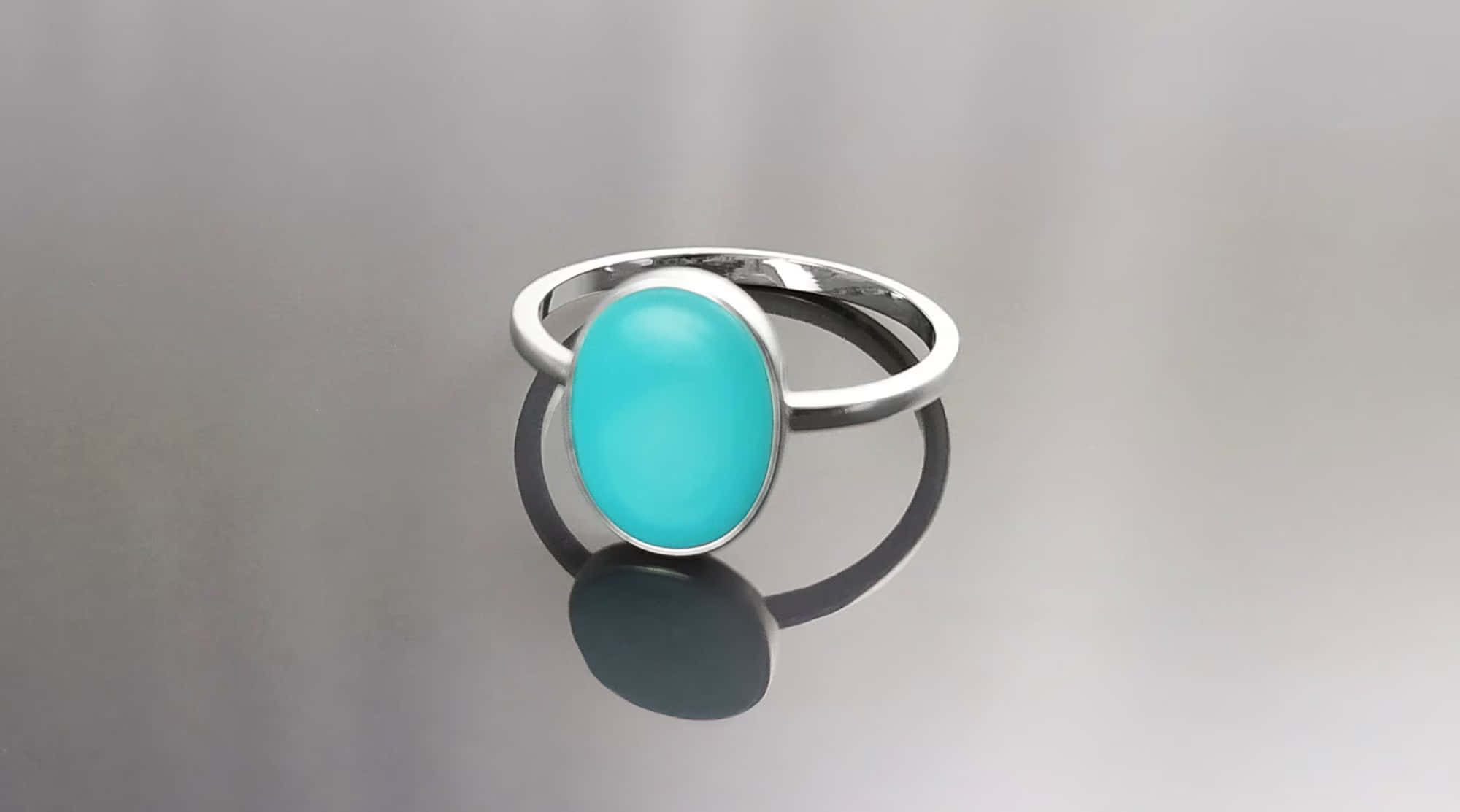 silver ring, vibrant turquoise oval stone, reflective gray surface, Full HD Desktop Wallpaper