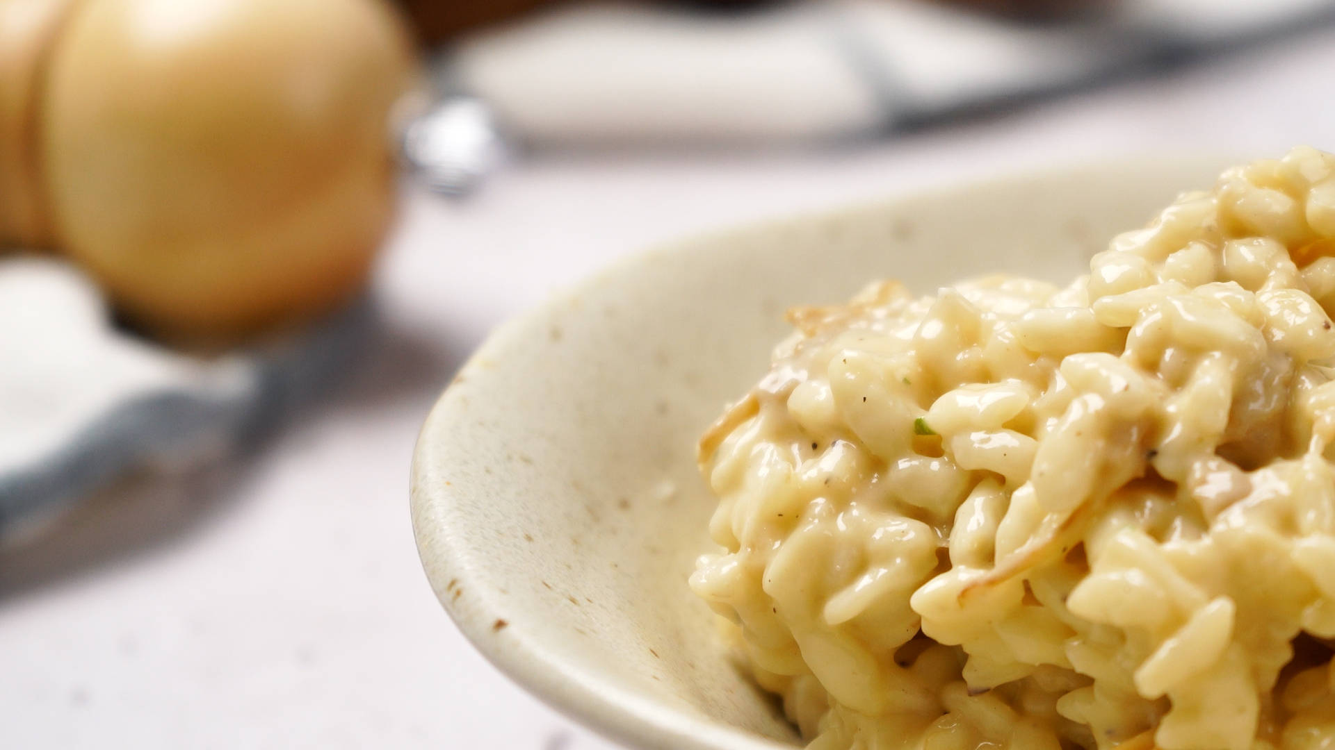gourmet mushroom risotto, golden rice grains, speckled ceramic bowl, Full HD Desktop Wallpaper