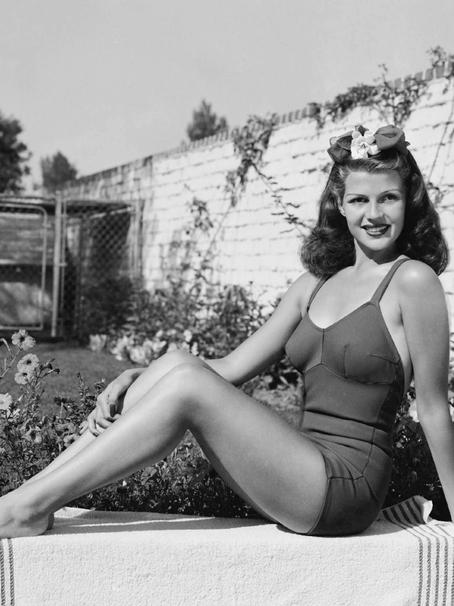 Rita Hayworth, vintage swimsuit, sunlit stone ledge, Full HD Phone Wallpaper