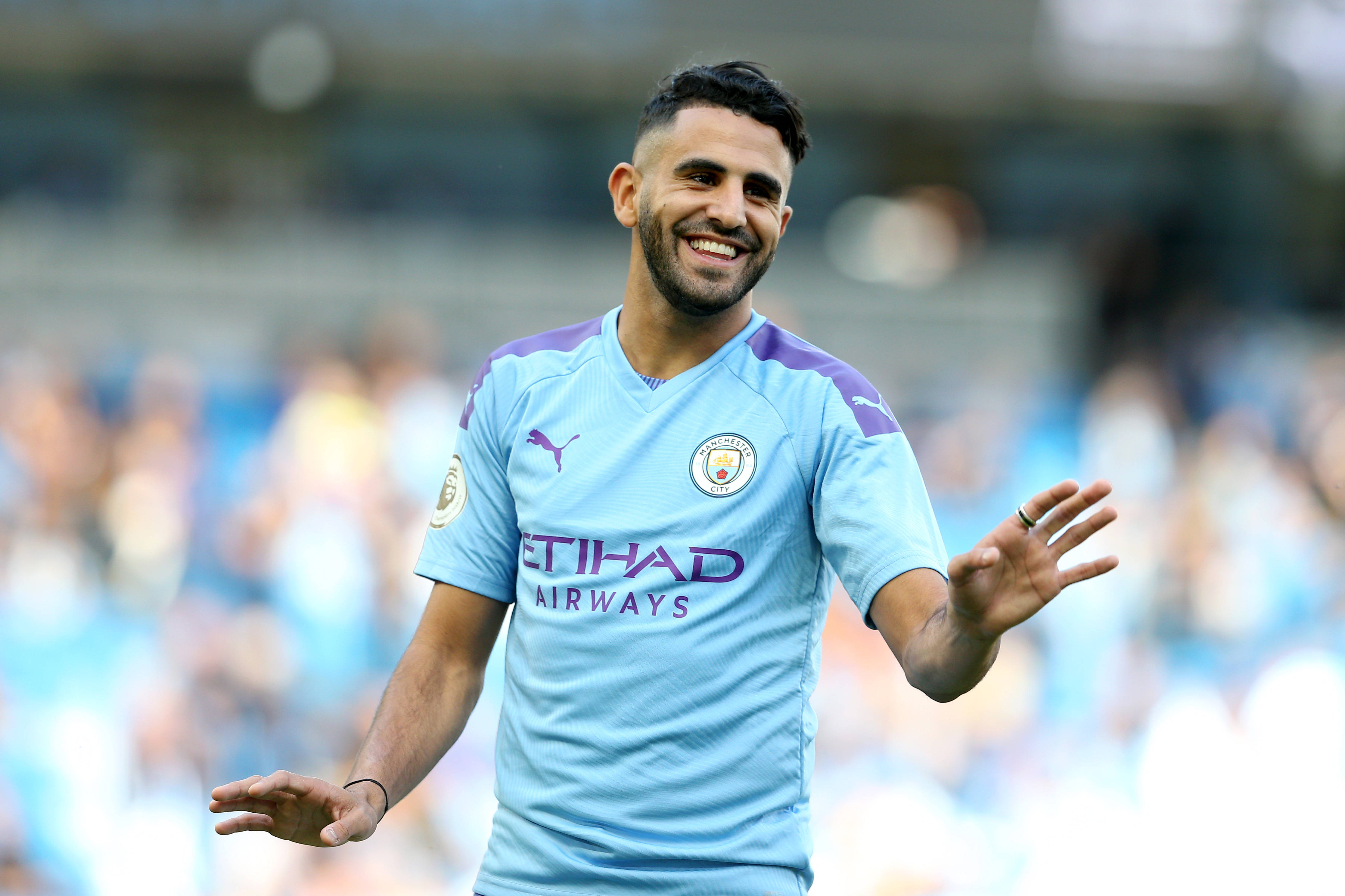Riyad Mahrez, light blue Manchester City jersey, sunlit stadium pitch, 4K Desktop Wallpaper