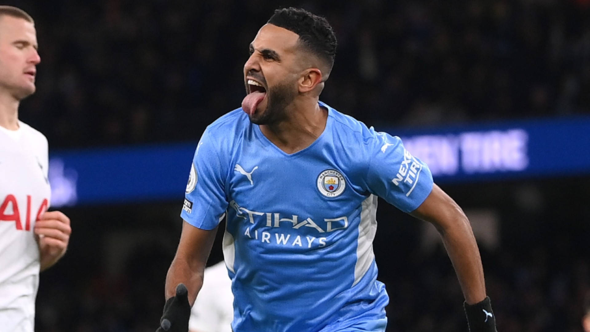 Riyad Mahrez, blue Manchester City jersey, tongue out, Full HD Desktop Wallpaper