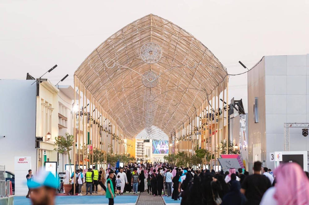 Riyadh, glowing arched canopy of lights, bustling urban exhibition hall, SD Desktop Wallpaper